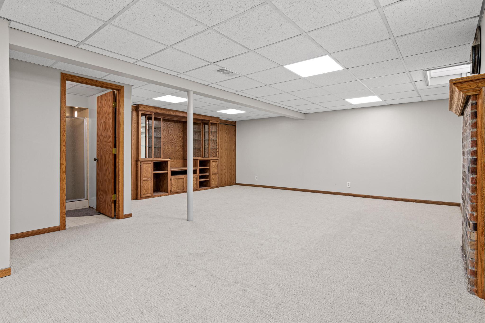 The lower level is a destination for fun! New paint and carpet throughout.