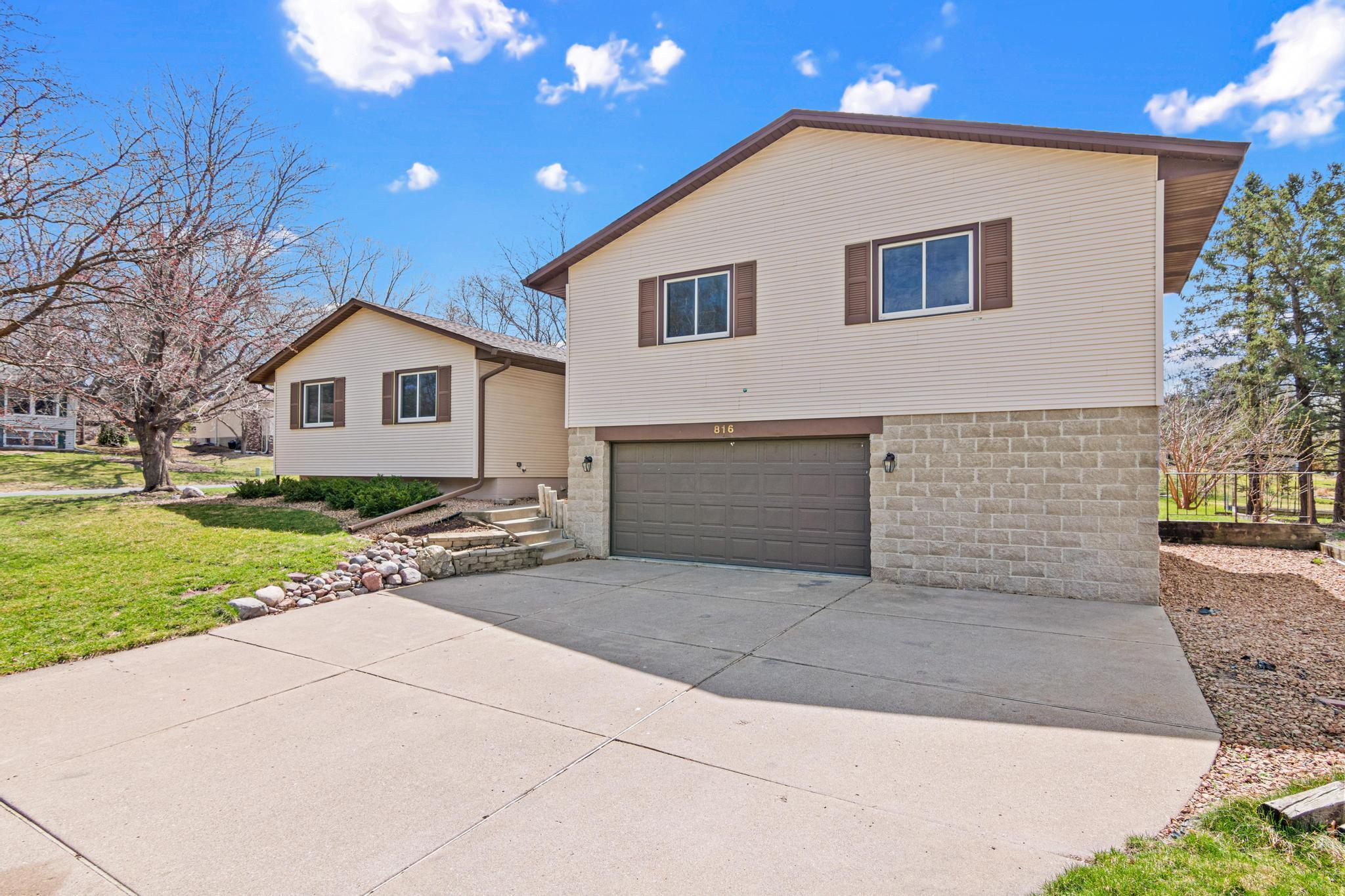Huge concrete driveway is wonderful for additional parking.
