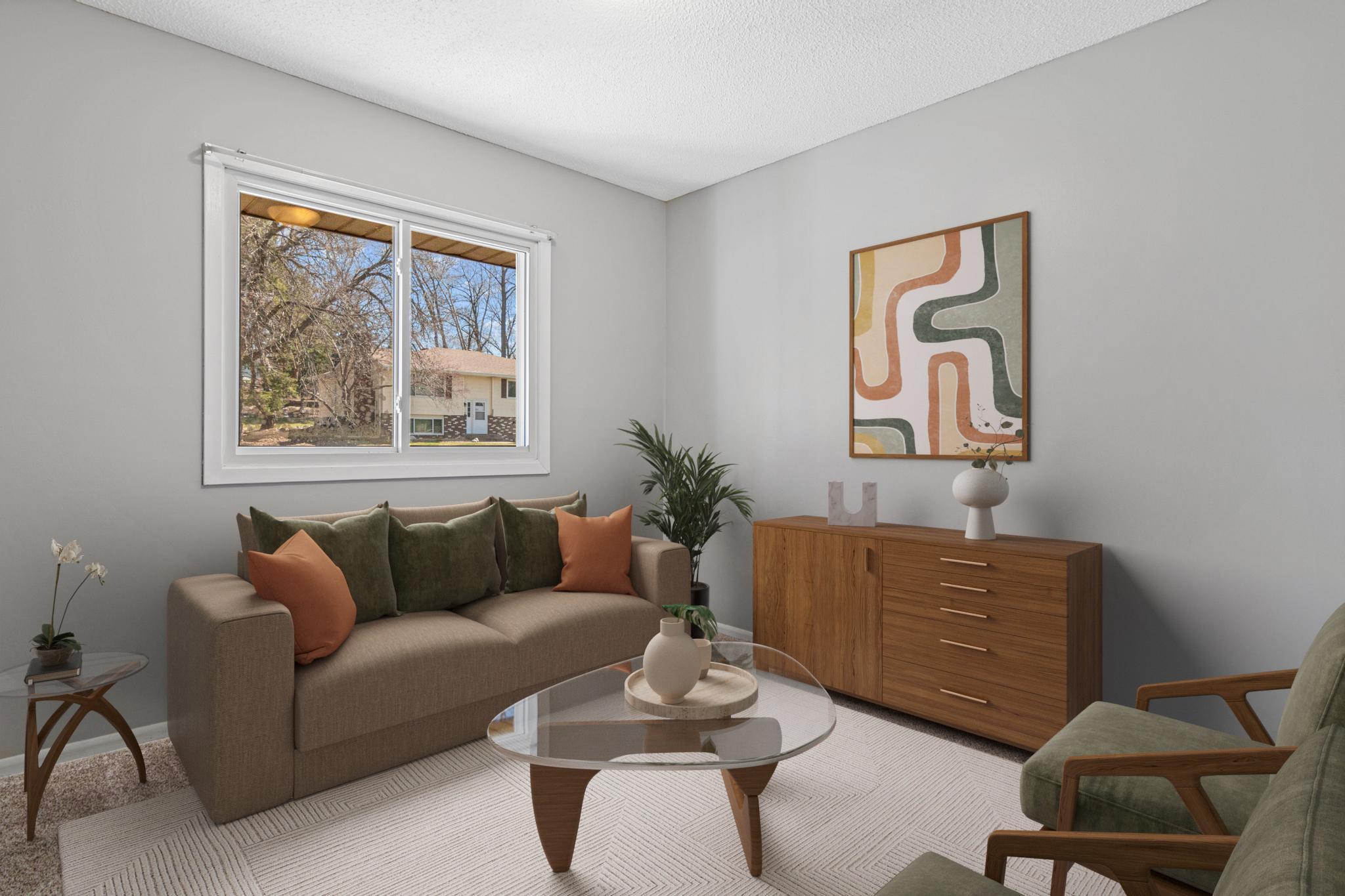 One of three bedrooms on the main level- visually staged as an office.