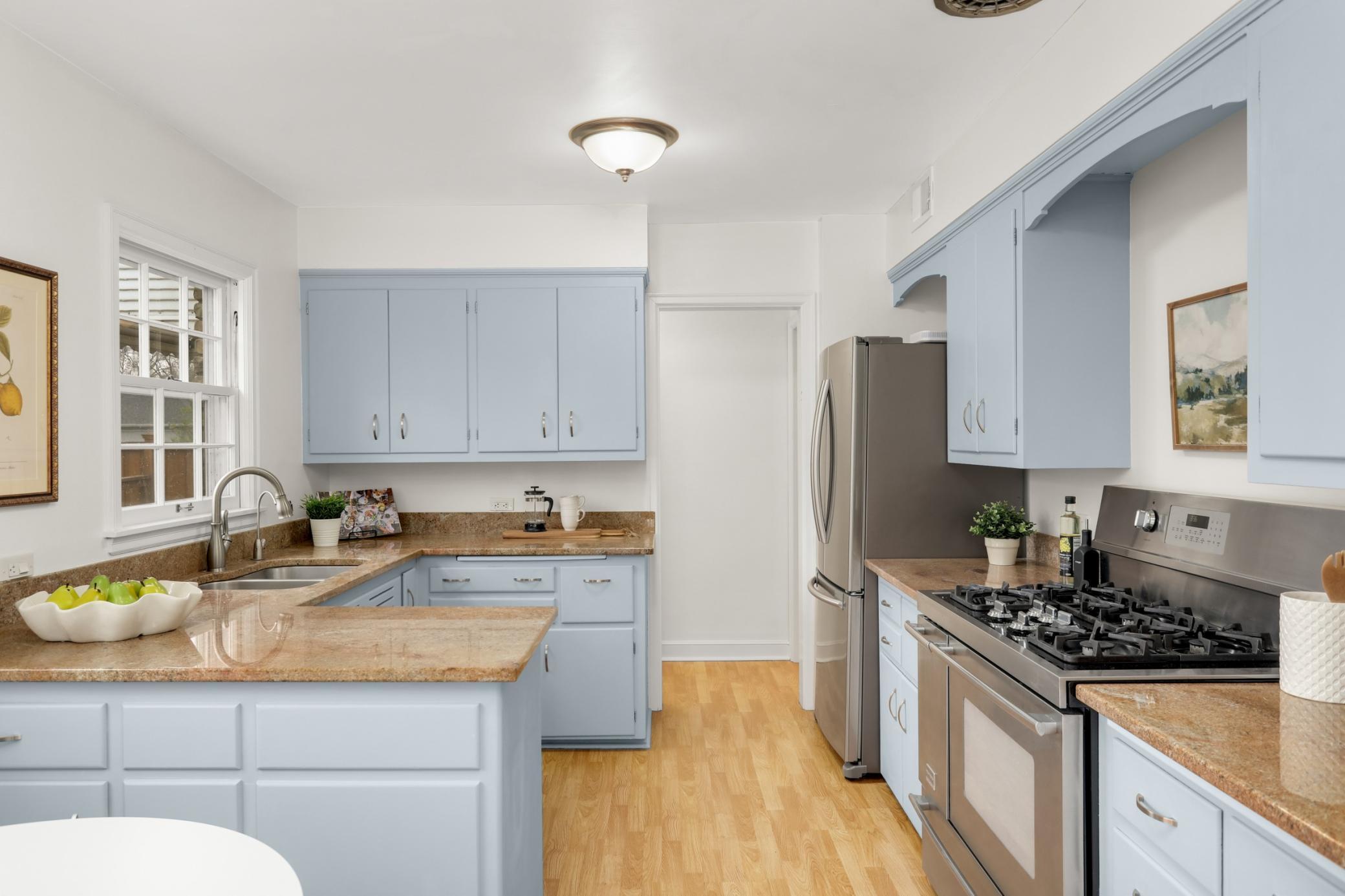 Eat in kitchen with nice cabinet and counter space as well as a pantry