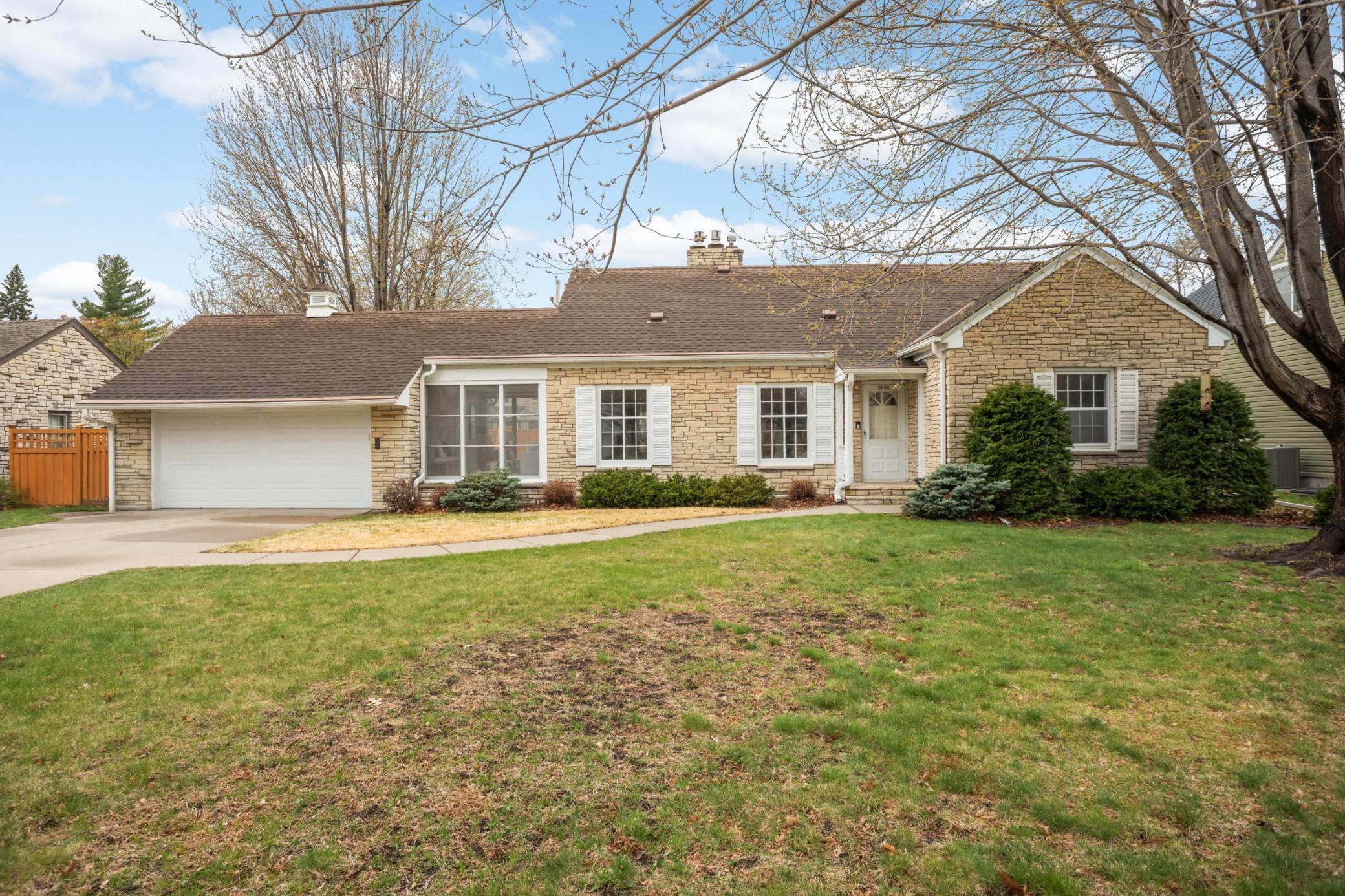 Welcome to this storybook stone and brick home situated on a 90 foot lot!