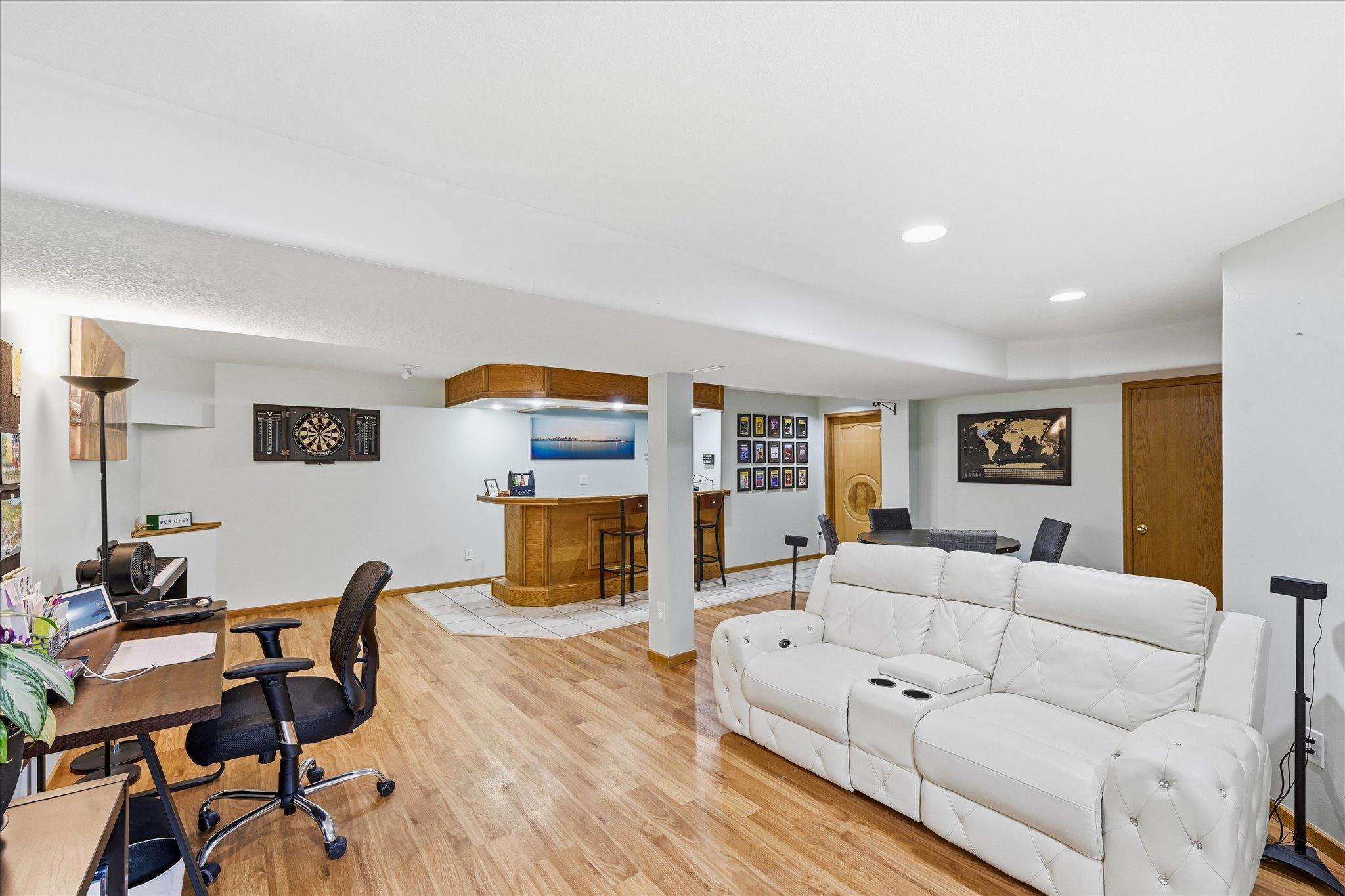 Lower level family room with egress window and built in bar