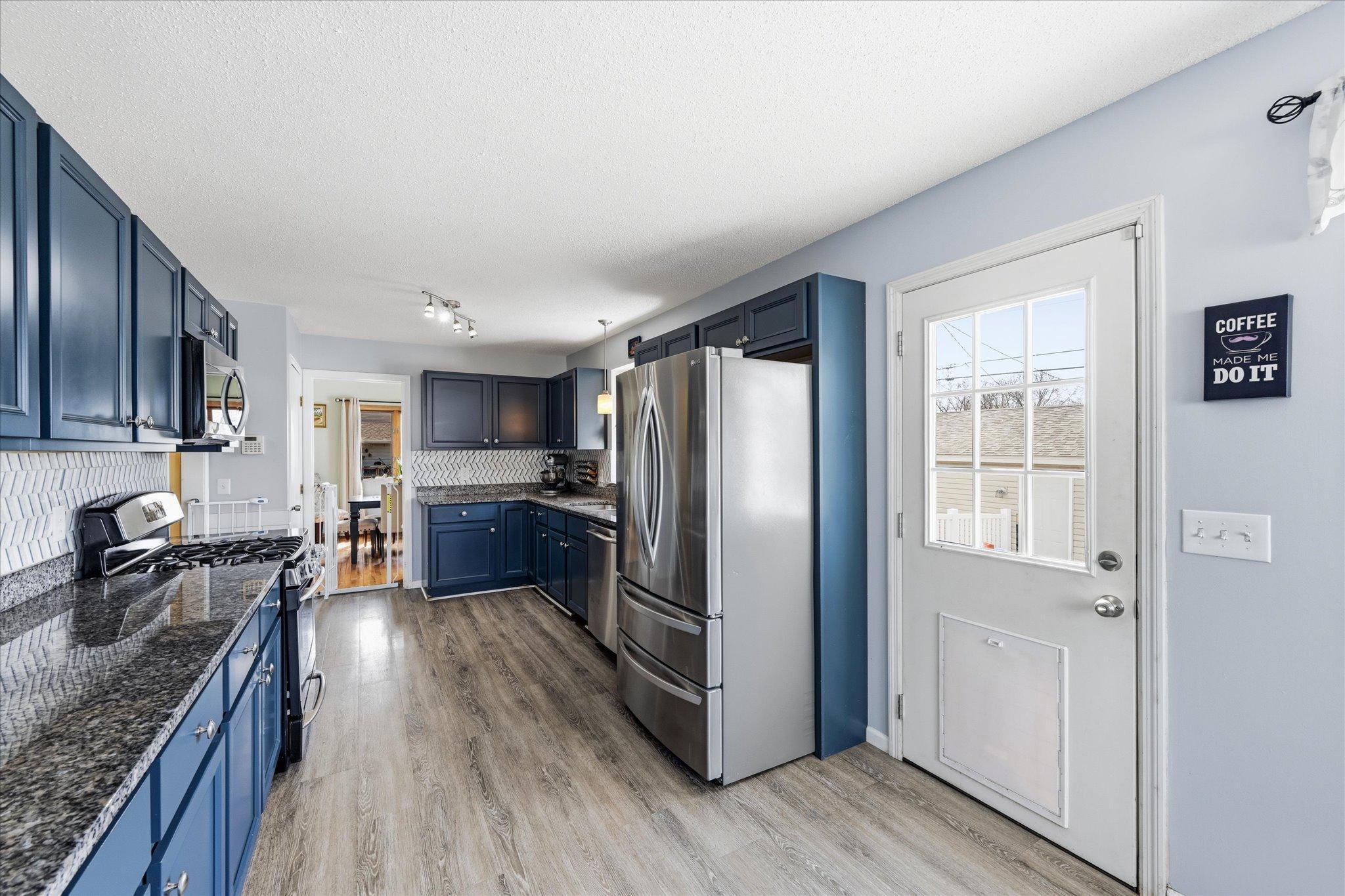 Newly updated kitchen with walk out to back yard