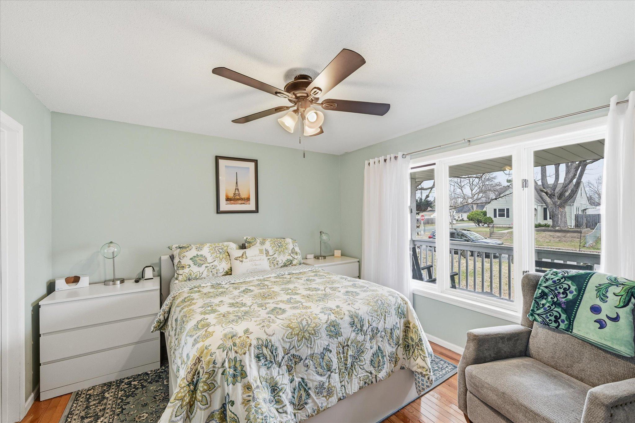 Main level primary bedroom with 3/4 bath and walk in closet