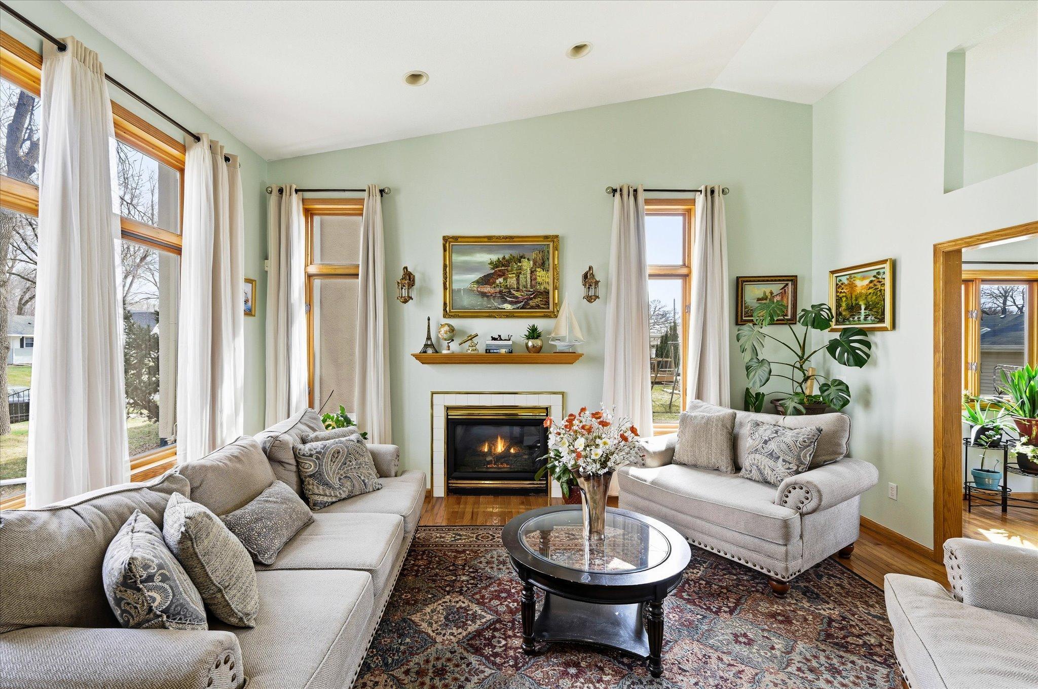Spacious living room with vaulted ceiling and gas fireplace