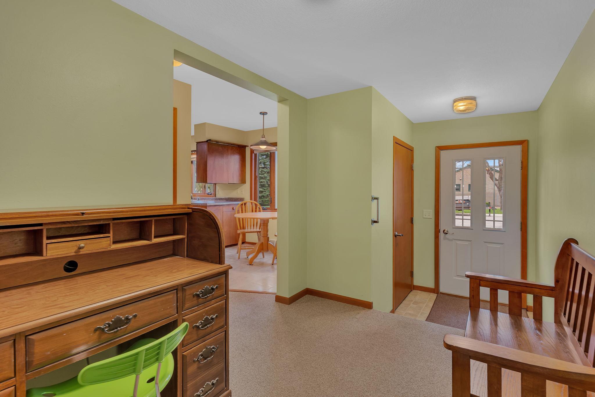 Enclosed Breezeway with access to the front drive, the garage and the 3-season porch