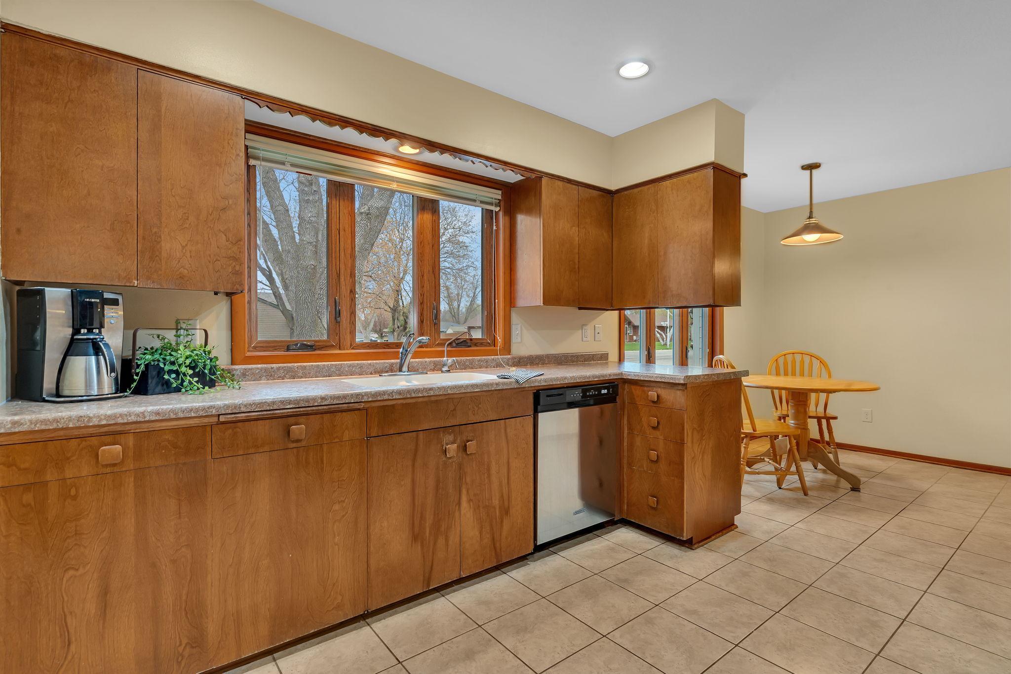 Kitchen window overlooking quiet Oak Ave