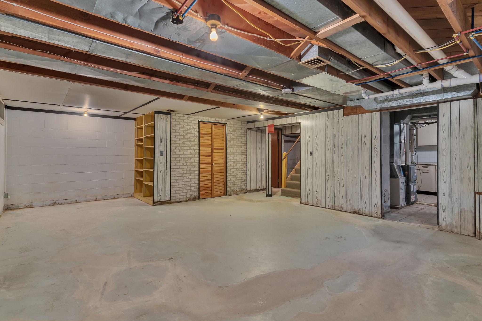 Unfinished basement with built in storage