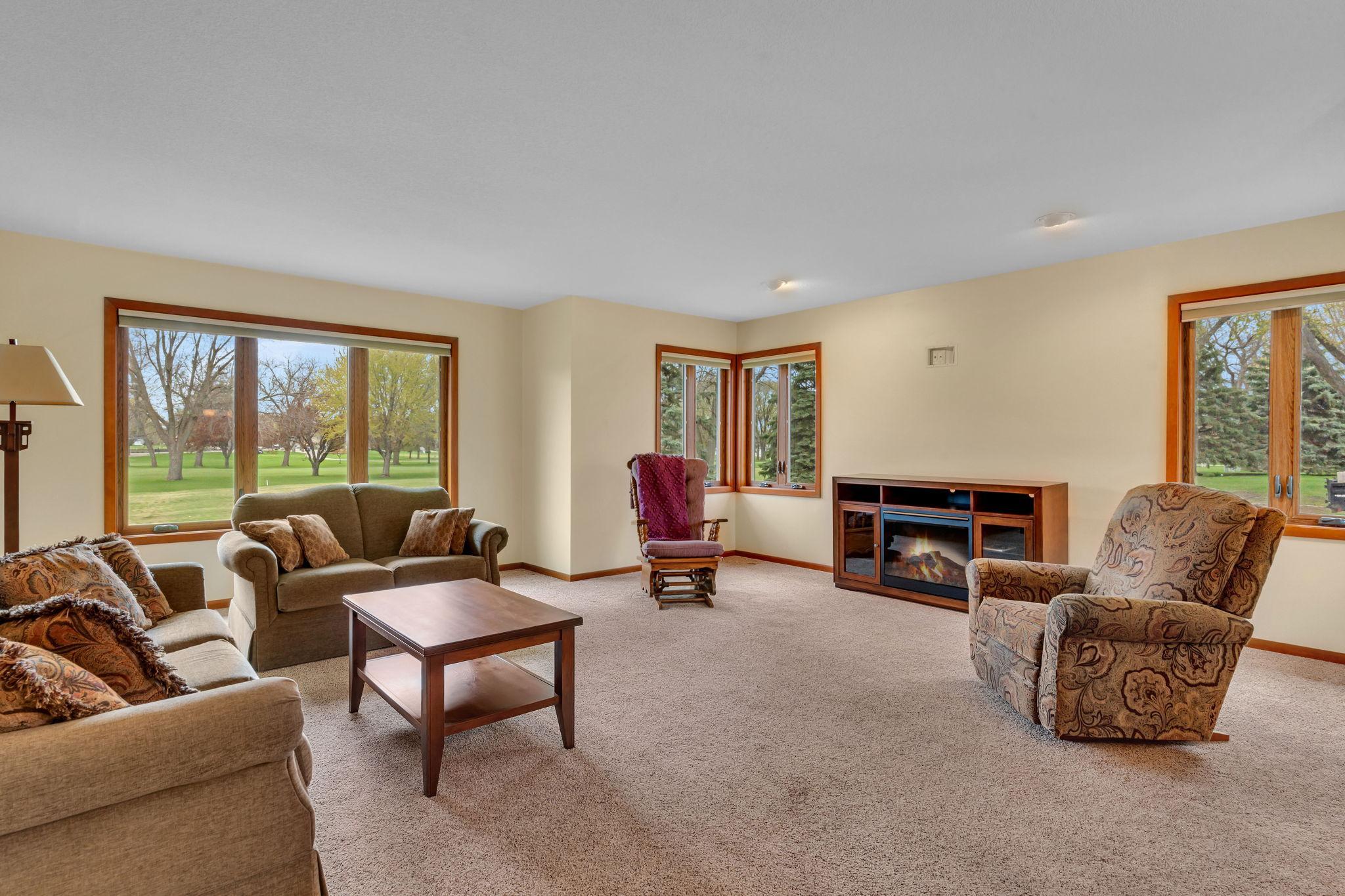 The large living room overlooks the golf course