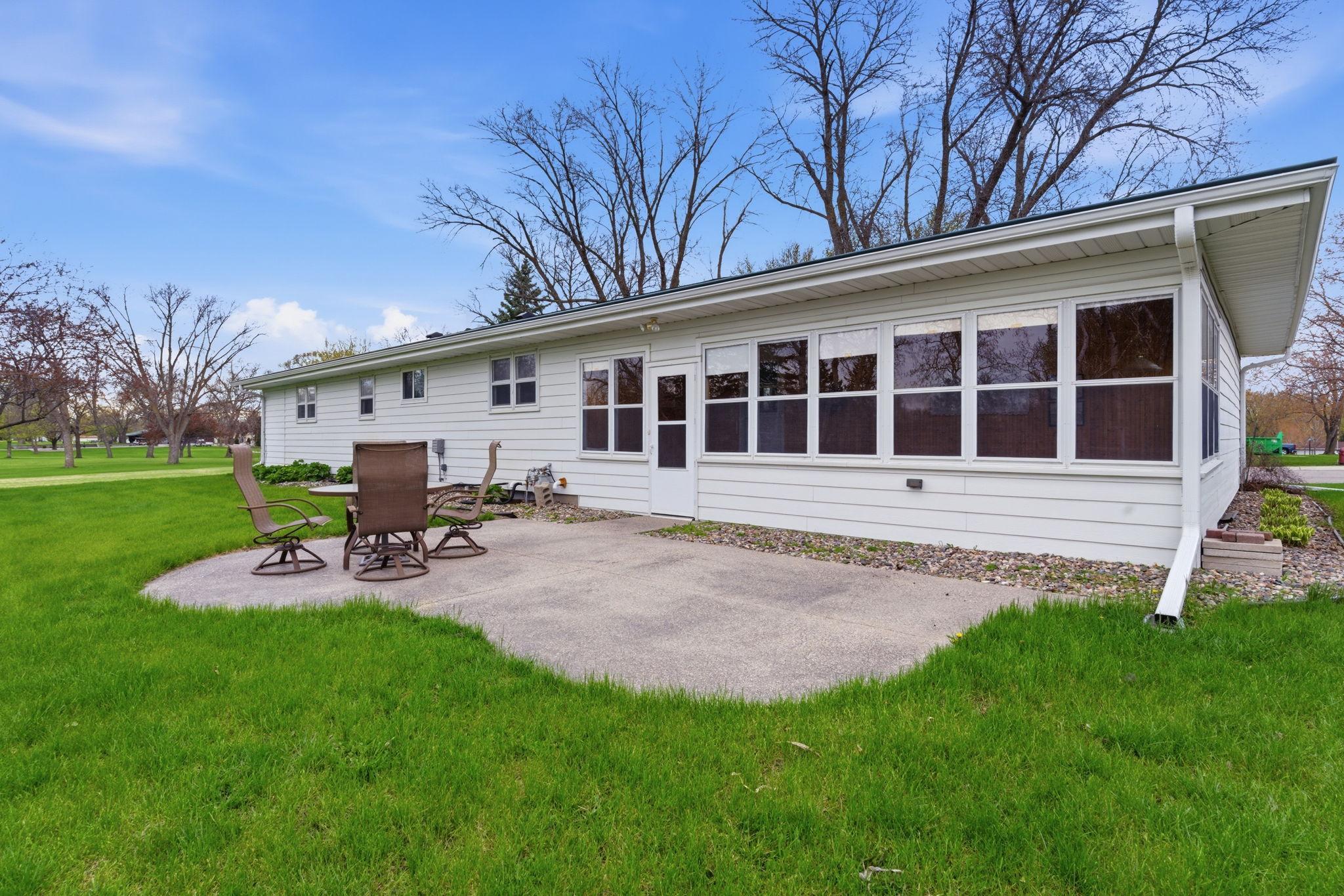 Relax on the rear concrete patio off of the 3 season porch