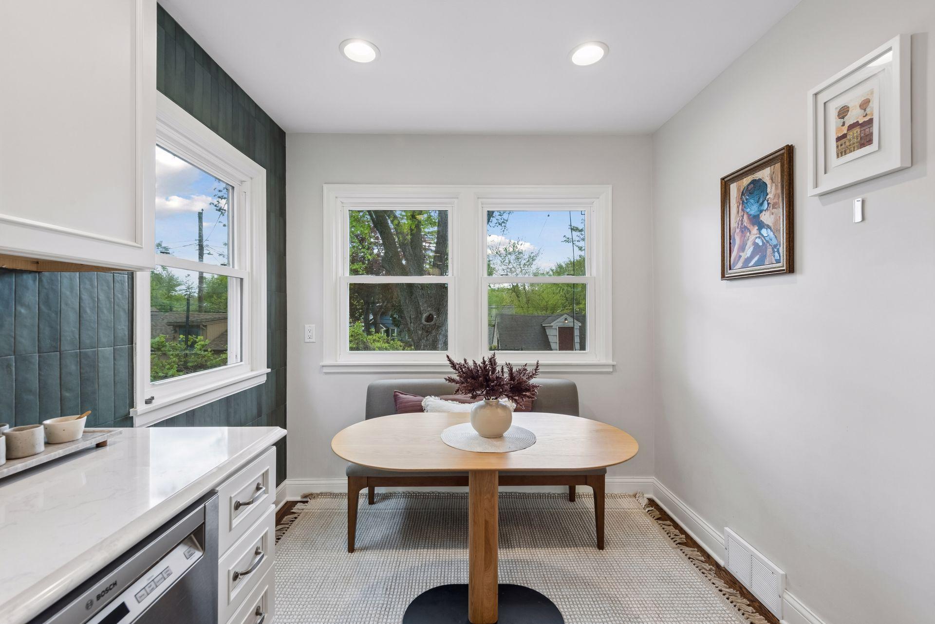 A charming breakfast nook offers a cozy additional space for casual dining or enjoying your morning coffee.