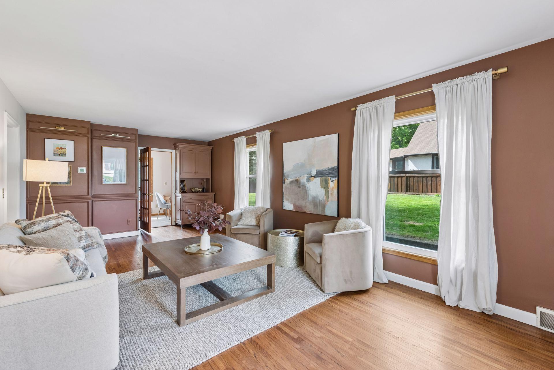 The main living area is warm and inviting, filled with abundant natural light that enhances its cozy atmosphere.