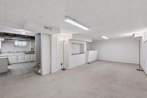 A large lower-level family room offers incredible potential and is ready for your finishing touches to make it your own.