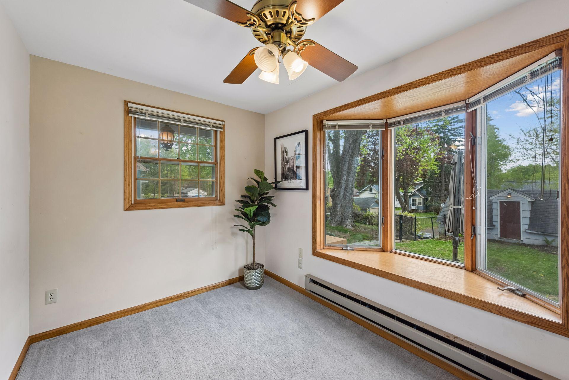A beautiful bay window brings in abundant natural light while adding timeless character and architectural charm to the space.