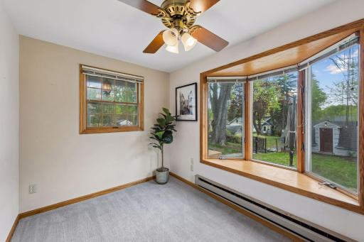 A beautiful bay window brings in abundant natural light while adding timeless character and architectural charm to the space.