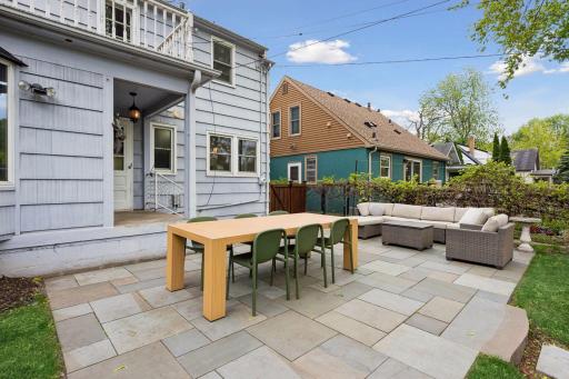 A beautiful New York bluestone paver patio provides the perfect setting to enjoy peaceful early mornings or relaxing late summer evenings.