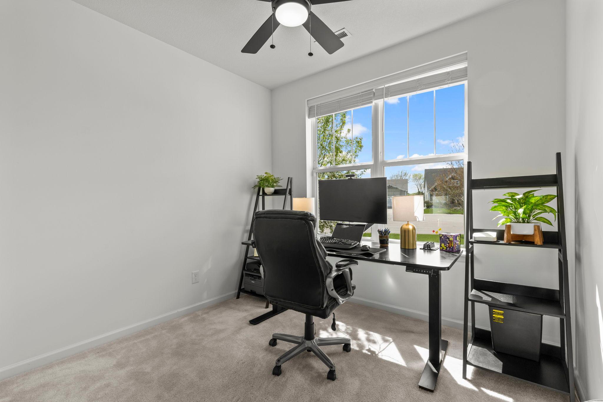 Bedroom 3, located just off the foyer, offers flexibility and can easily function as a home office
