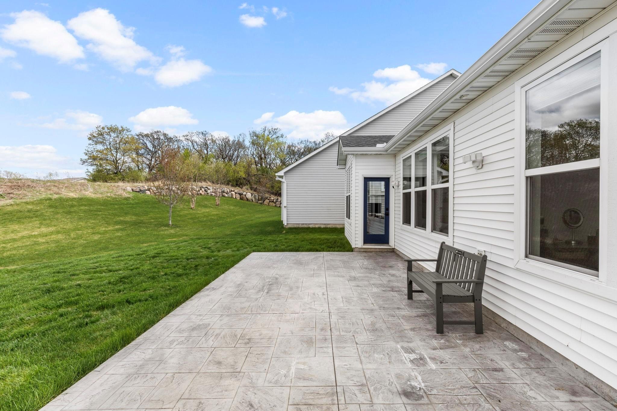 Stamped concrete patio offers a great space for some patio furniture and your grill