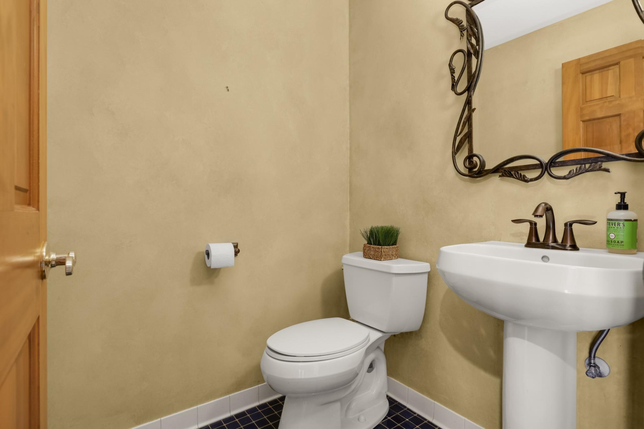 Main floor 1/2 bath is perfect for guests.