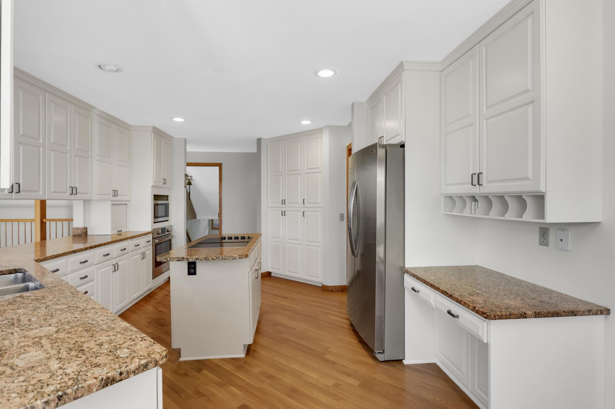 Kitchen is updated and a cooks dream! Abundant storage & pantry space, a little desk area perfect for a coffee station or spot for the home laptop.