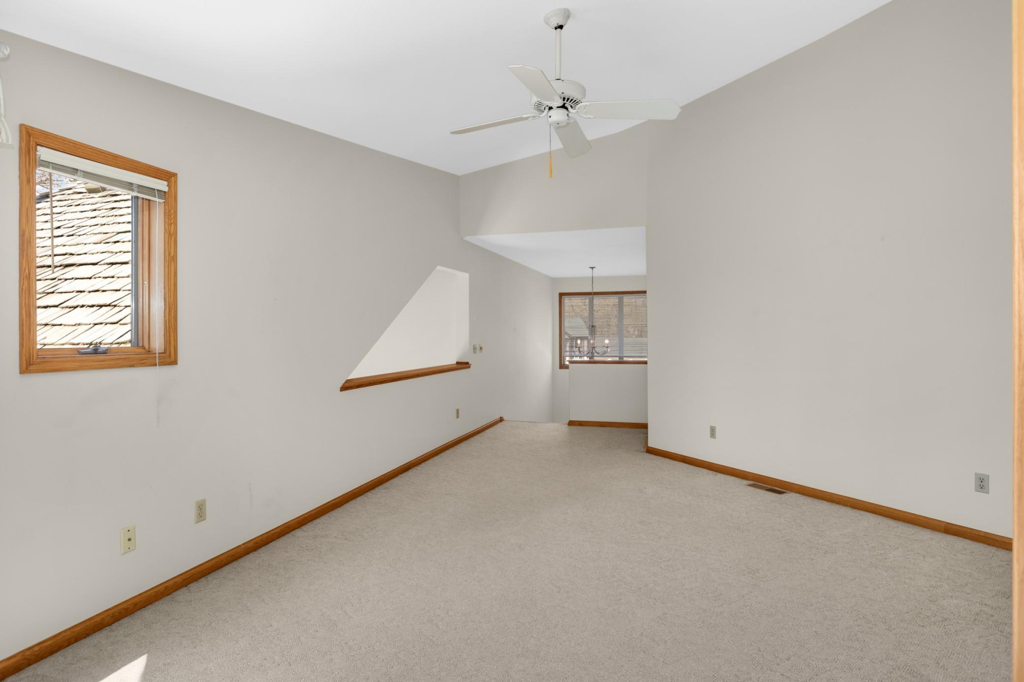 You will love this upper level loft area that overlooks the family room. This is not a "cookie cutter" home...distinctive design and layout! This would make a wonderful office area, craft room, play area or kids hang out!