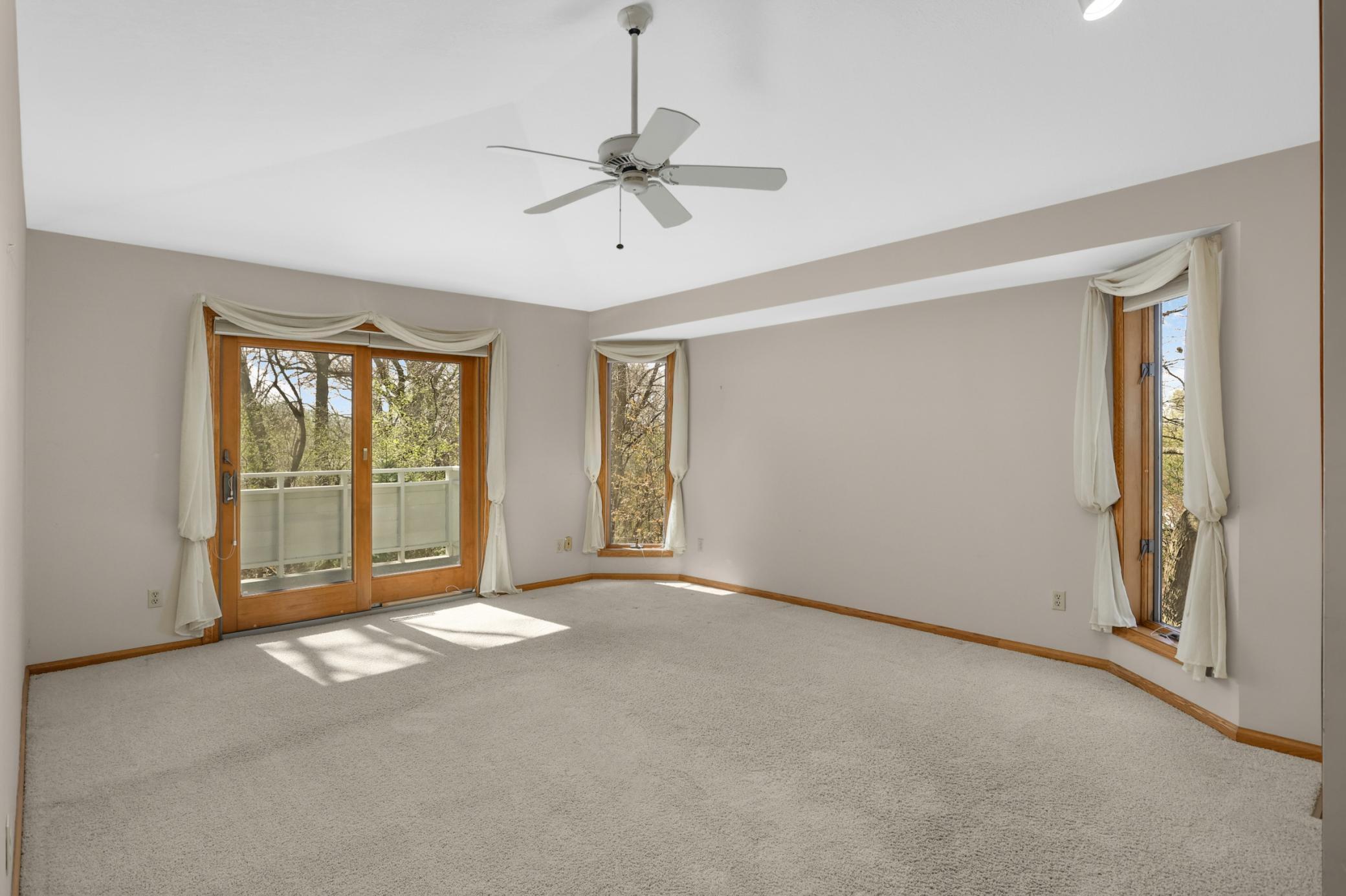 Primary bedroom is quite large with abundant natural light, doors that lead to a fantastic deck and private bathroom. Carpets throughout home professionally steam cleaned.