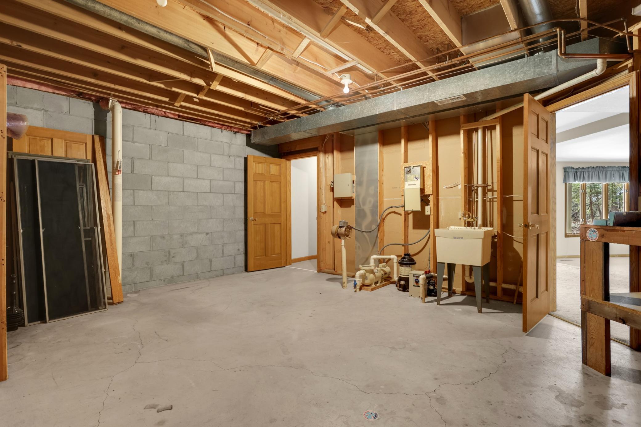 So much storage in this home! 2 separate storage rooms, door leads to upper level garage area. 2 entrances from garage into home - main entry into kitchen, or down the stairs into the lower level.