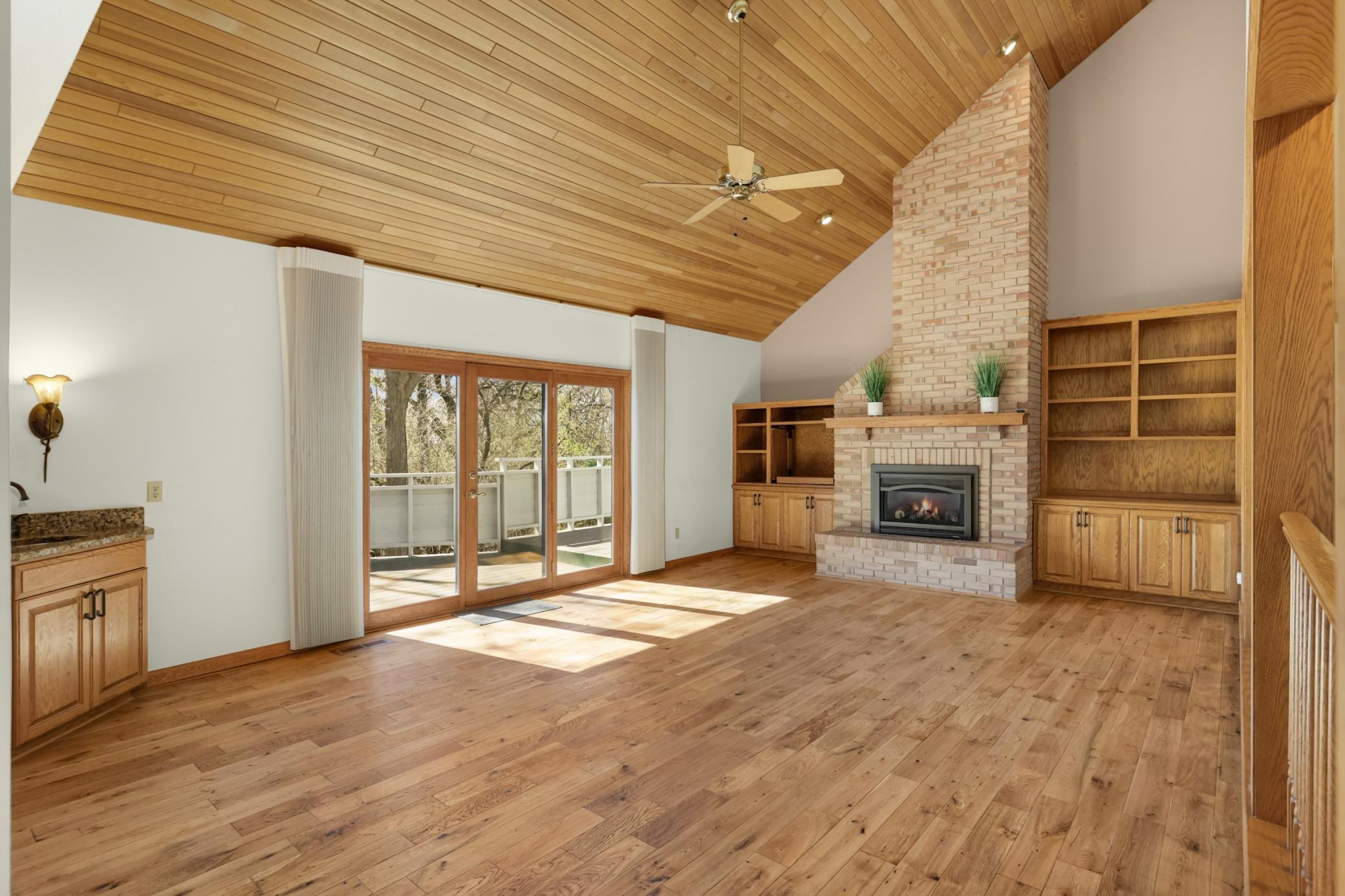 Main floor family room is quite large! Vaulted ceiling, wet bar, custom designed cabinets and media center. Gas fireplace.