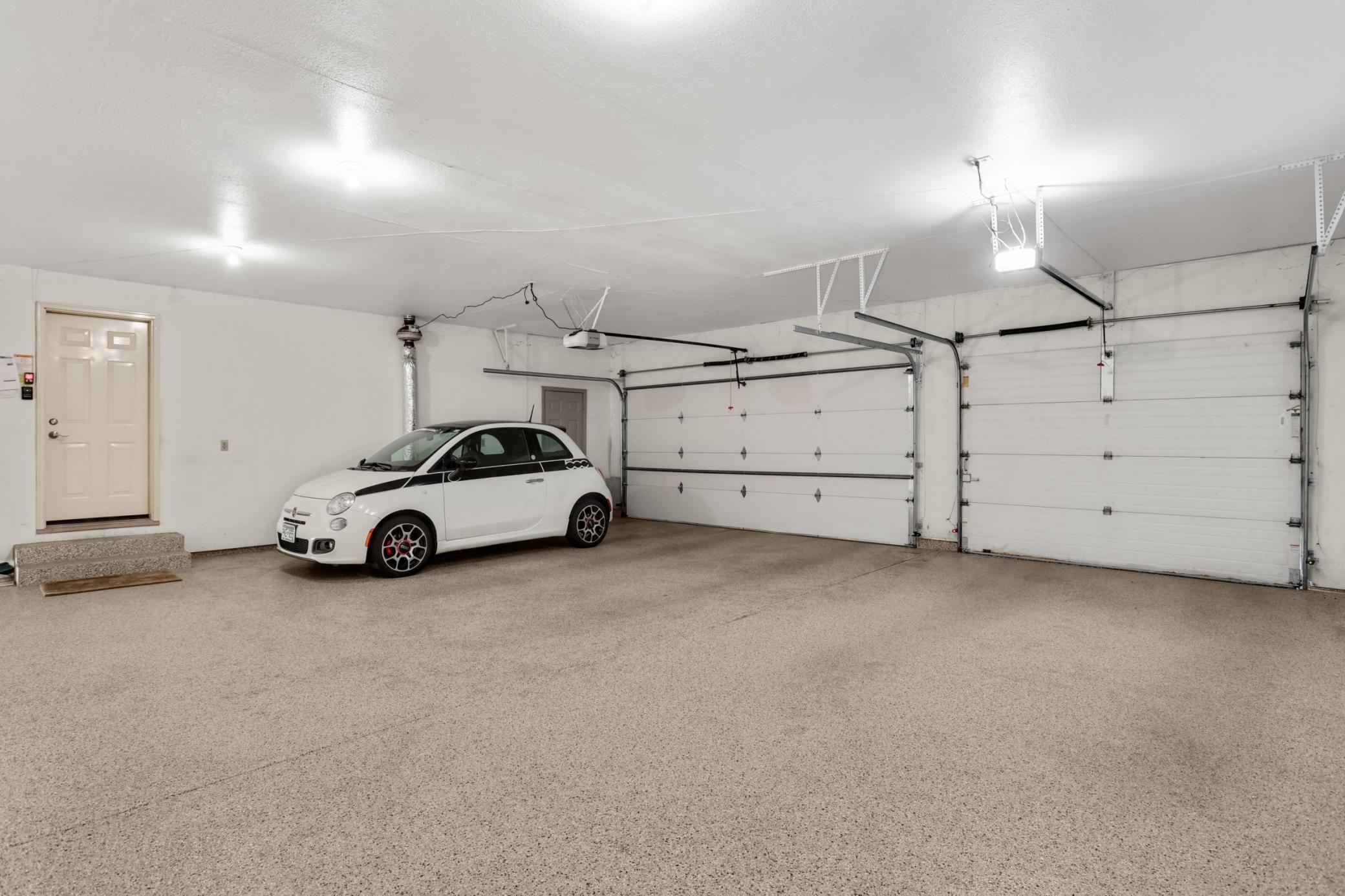 large 29' x 29' 3 car garage with epoxy floors. Tons of space for the cars, bikes, strollers or sporting equipment!