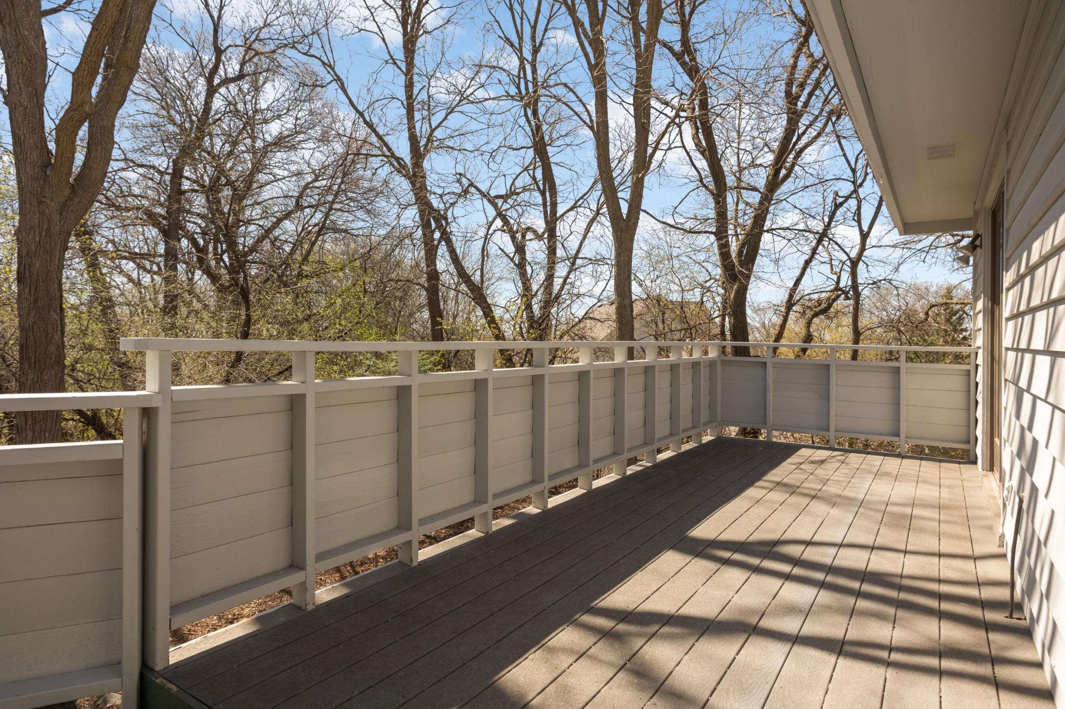 You will love this expansive deck - 55' in length! Mature trees offer privacy and serenity while enjoying this space. Deck boards are maintenance free material.