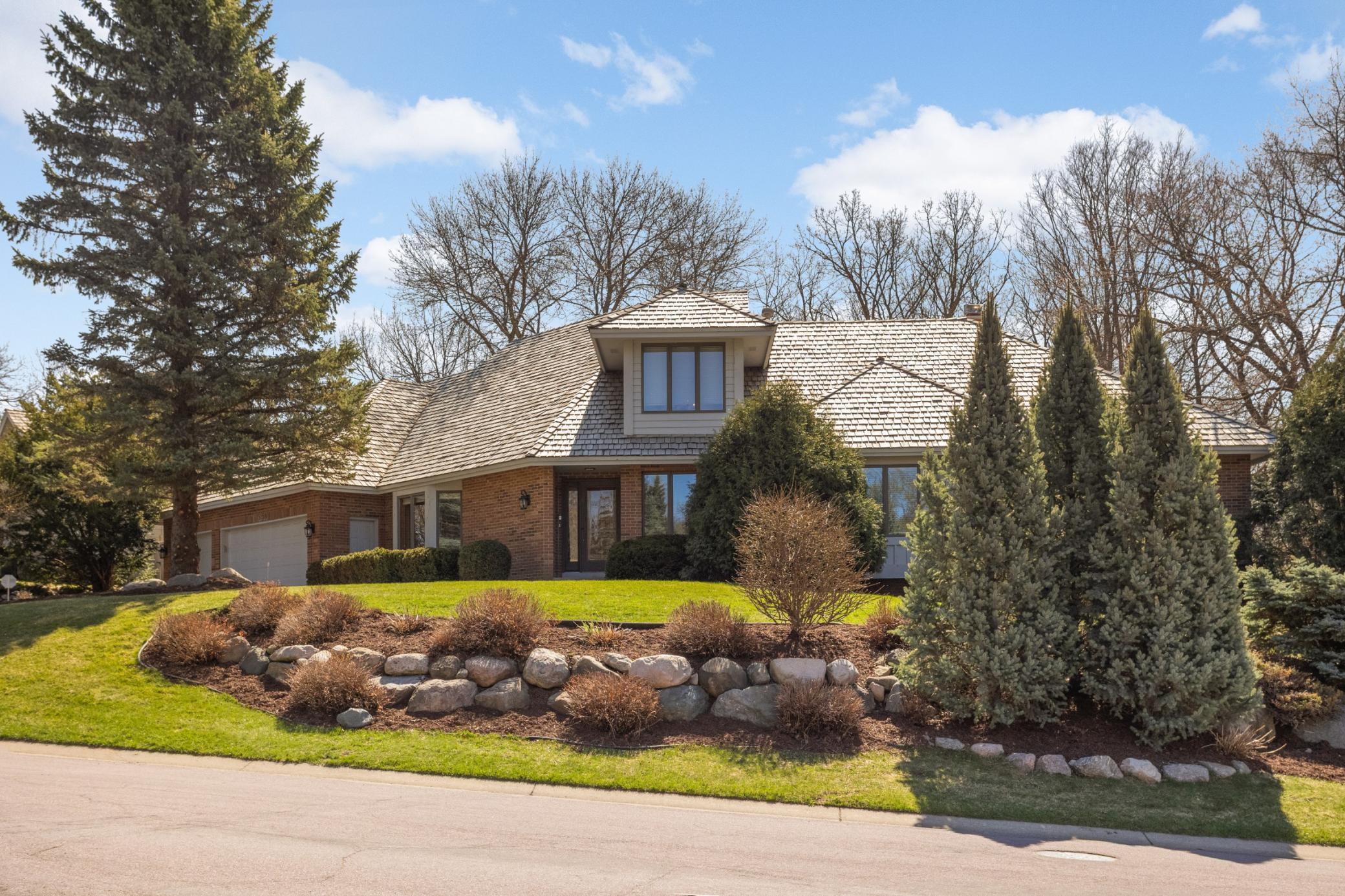 Stunning custom-built home in coveted Apple Valley neighborhood. Home lives like a rambler with bonus loft and office on upper level. Full walkout lower level and very private lot. Quality throughout!