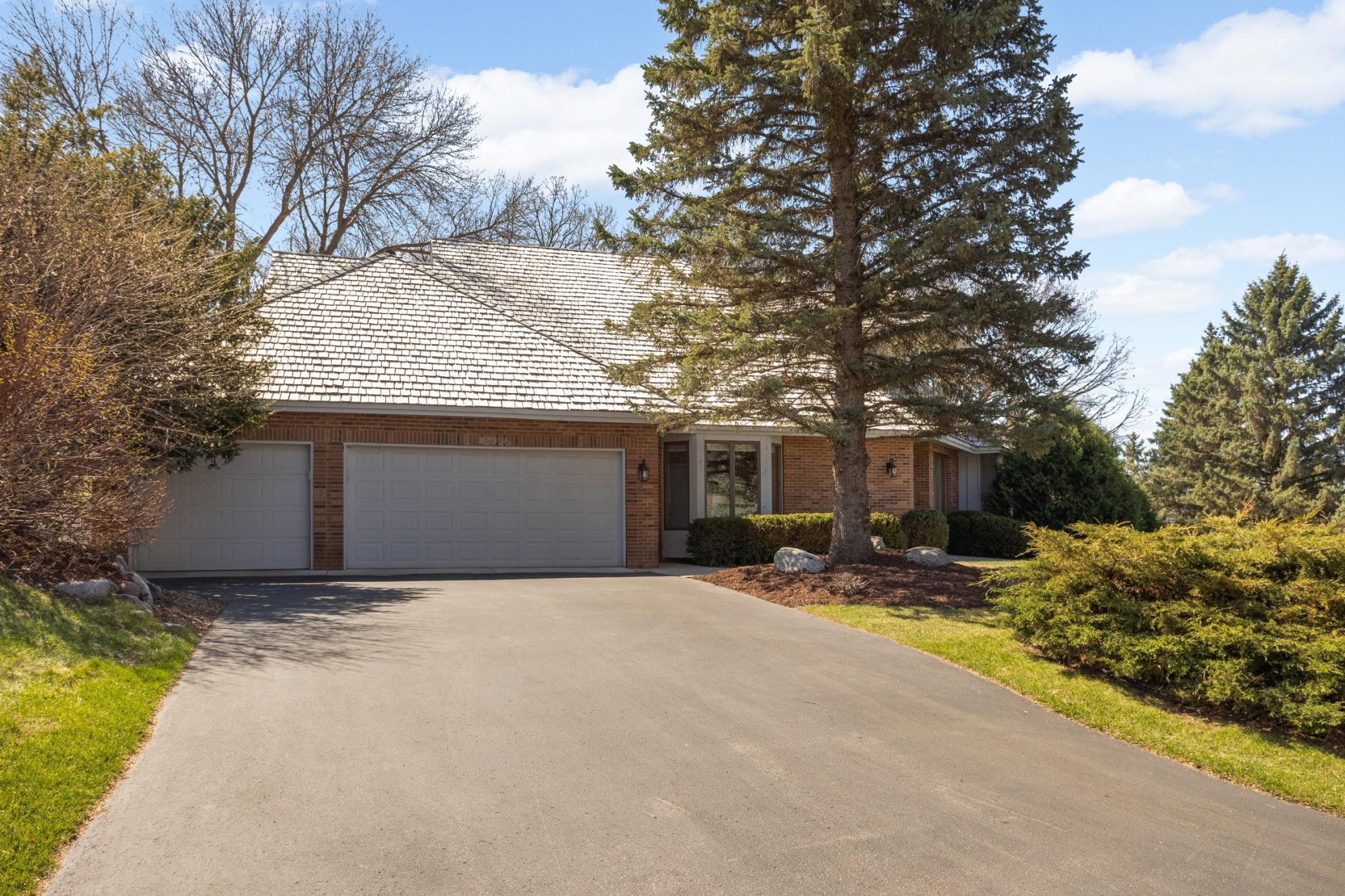 Spacious home that lives like a rambler - Primary suite on main floor. 4 beds + office, 4 bathrooms, gorgeous private lot. Fun floorplan - not the same "cookie cutter" home! Furnace & AC replaced in 2025.