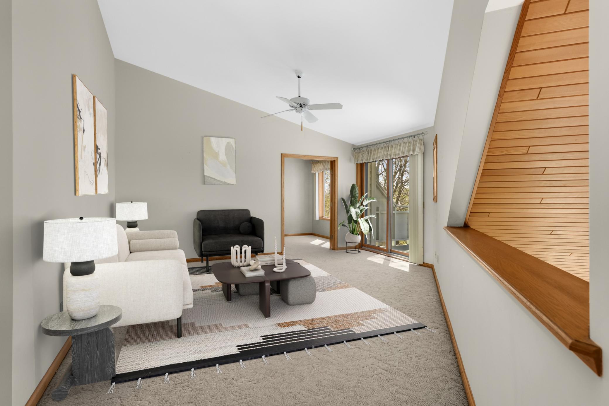 Virtual Staged Loft area - imagine the possibilities! Sliding door leads to small deck, French doors lead to office area. Room overlooks the vaulted main floor family room.