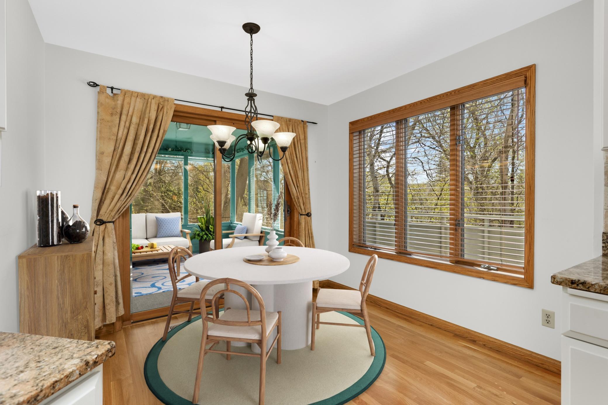 Virtual Stage dining area in kitchen. Screened porch is attached to this wonderful space. Enjoy morning coffee on your porch!