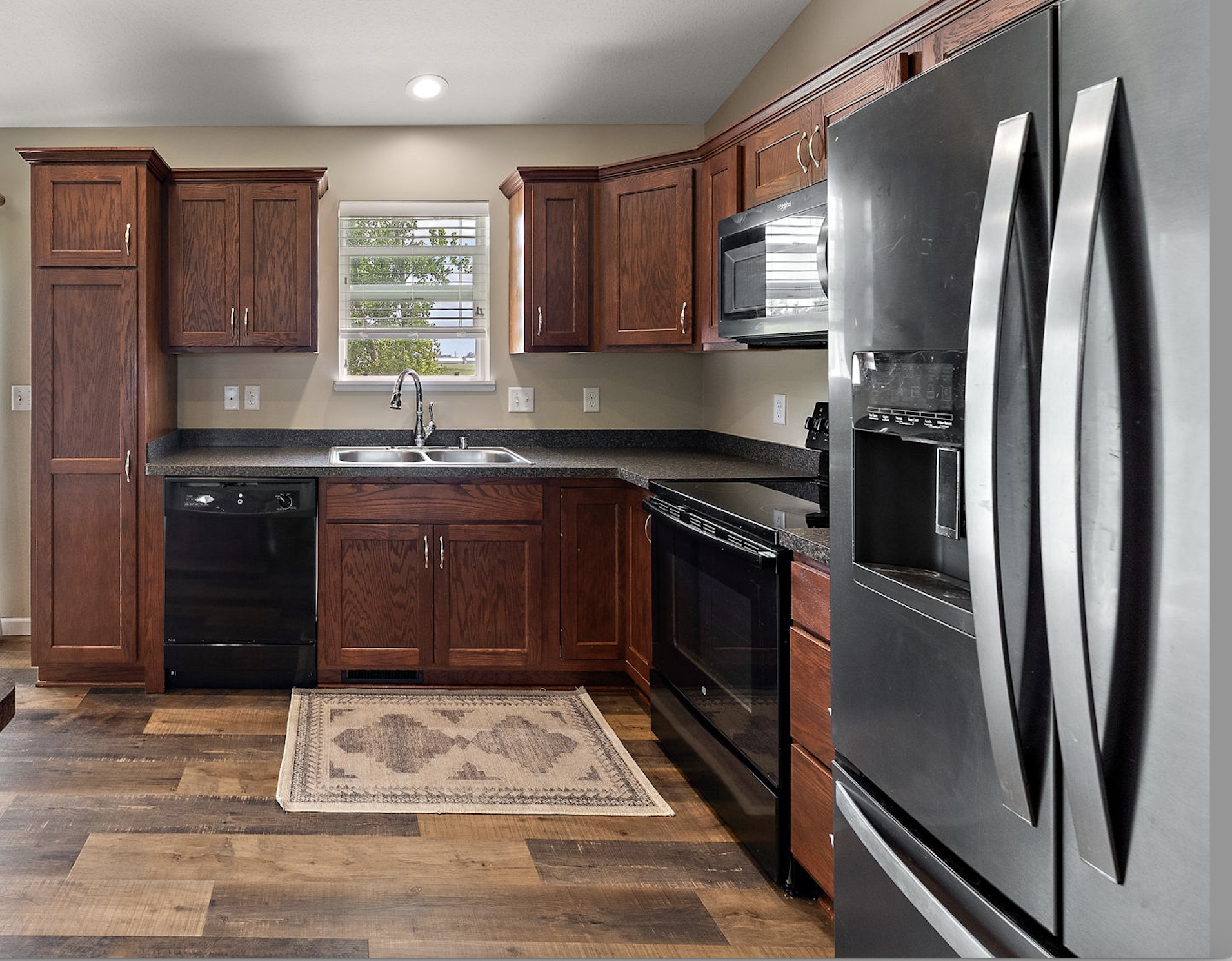 Plenty of storage in this beautiful kitchen which includes a wall pantry plus a hallway pantry closet!