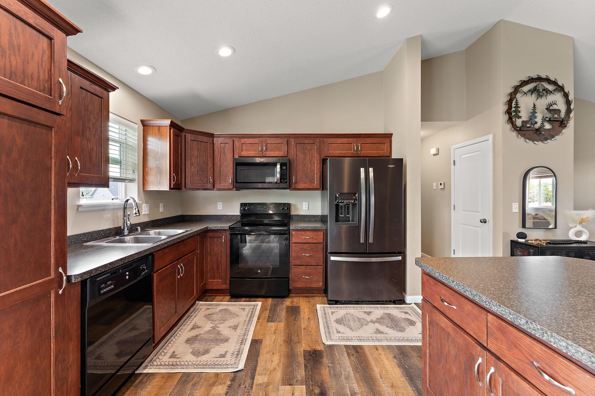 Plenty of cabinet storage, additional pantry closet nearby, large kitchen space