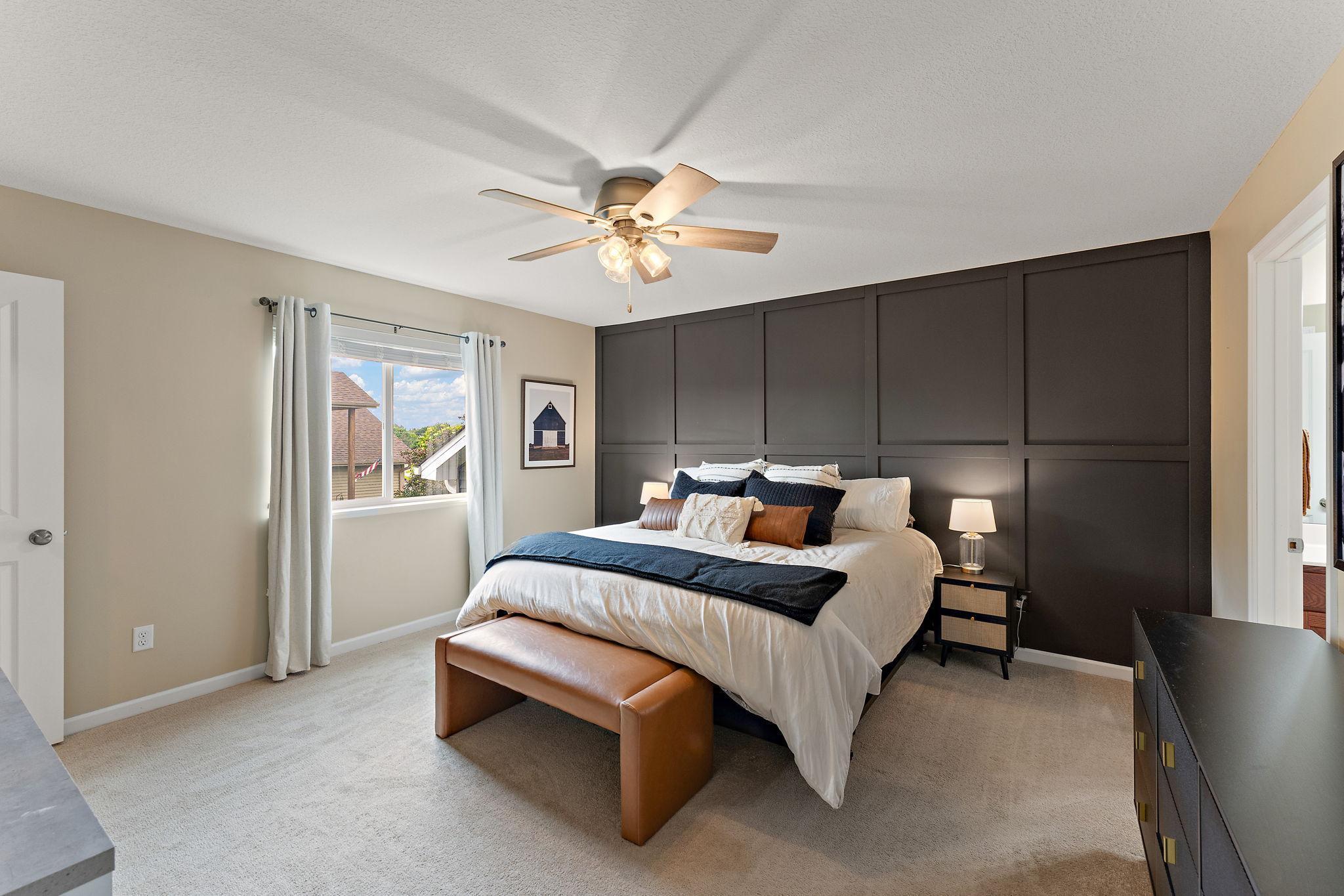 Spacious primary room on main, complete with private bath and walk-in closet. Fantastic space!