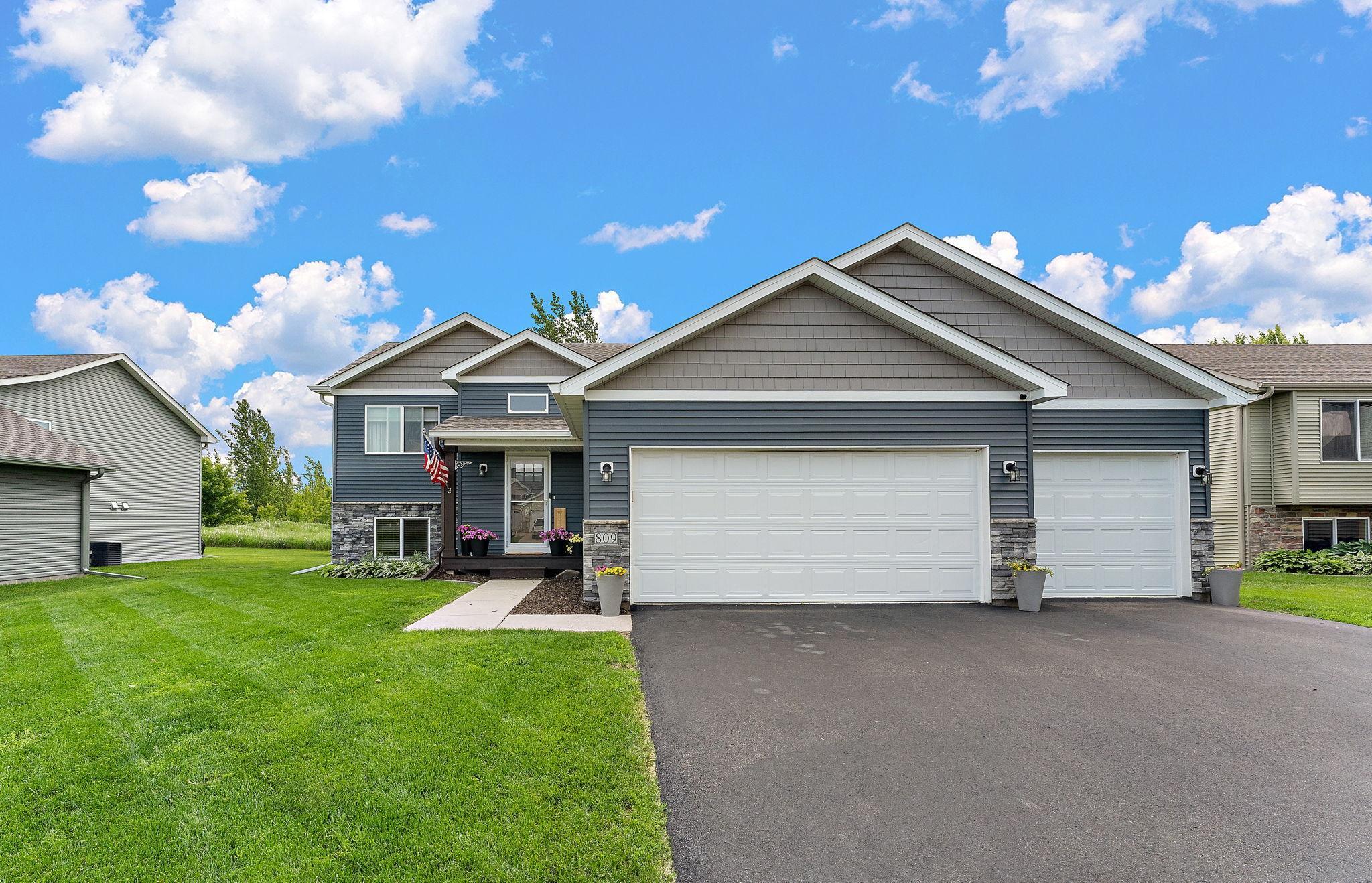 Over 2,600 finished sq ft and beautifully finished top to bottom! Five spacious bedrooms, 3 baths and a flex room plus patio!