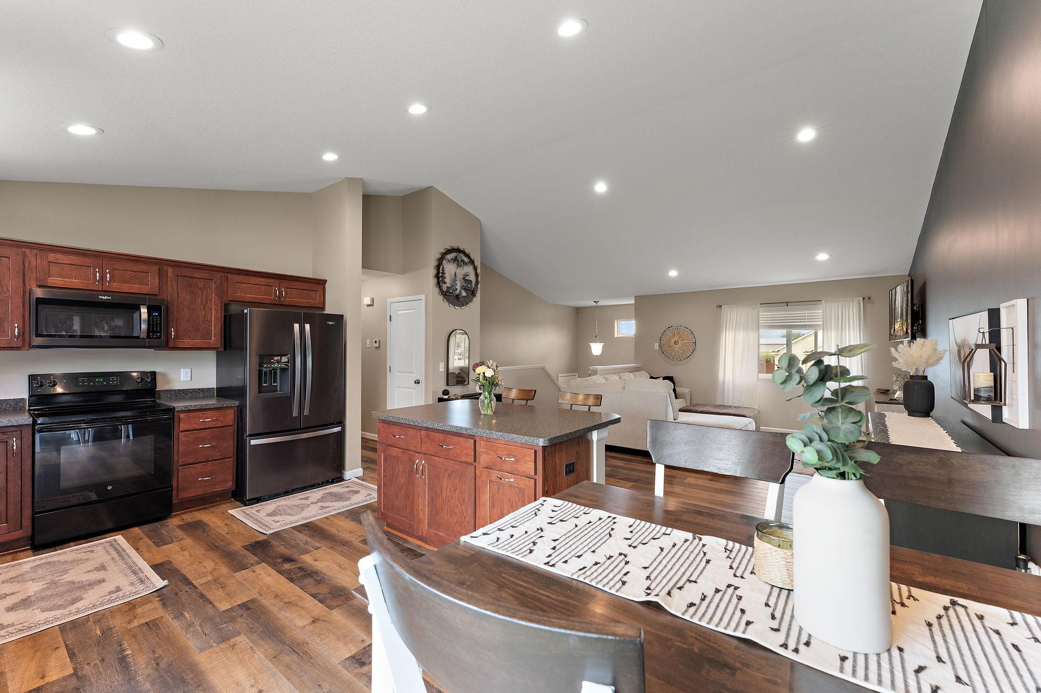 Fantastic home shows like a model - Larger foundation offers so much space plus vaulted ceiling, new flooring, large kitchen, fireplace, three car garage, three bathrooms, five spacious bedrooms, flex room, landscaped patio! WOW!!