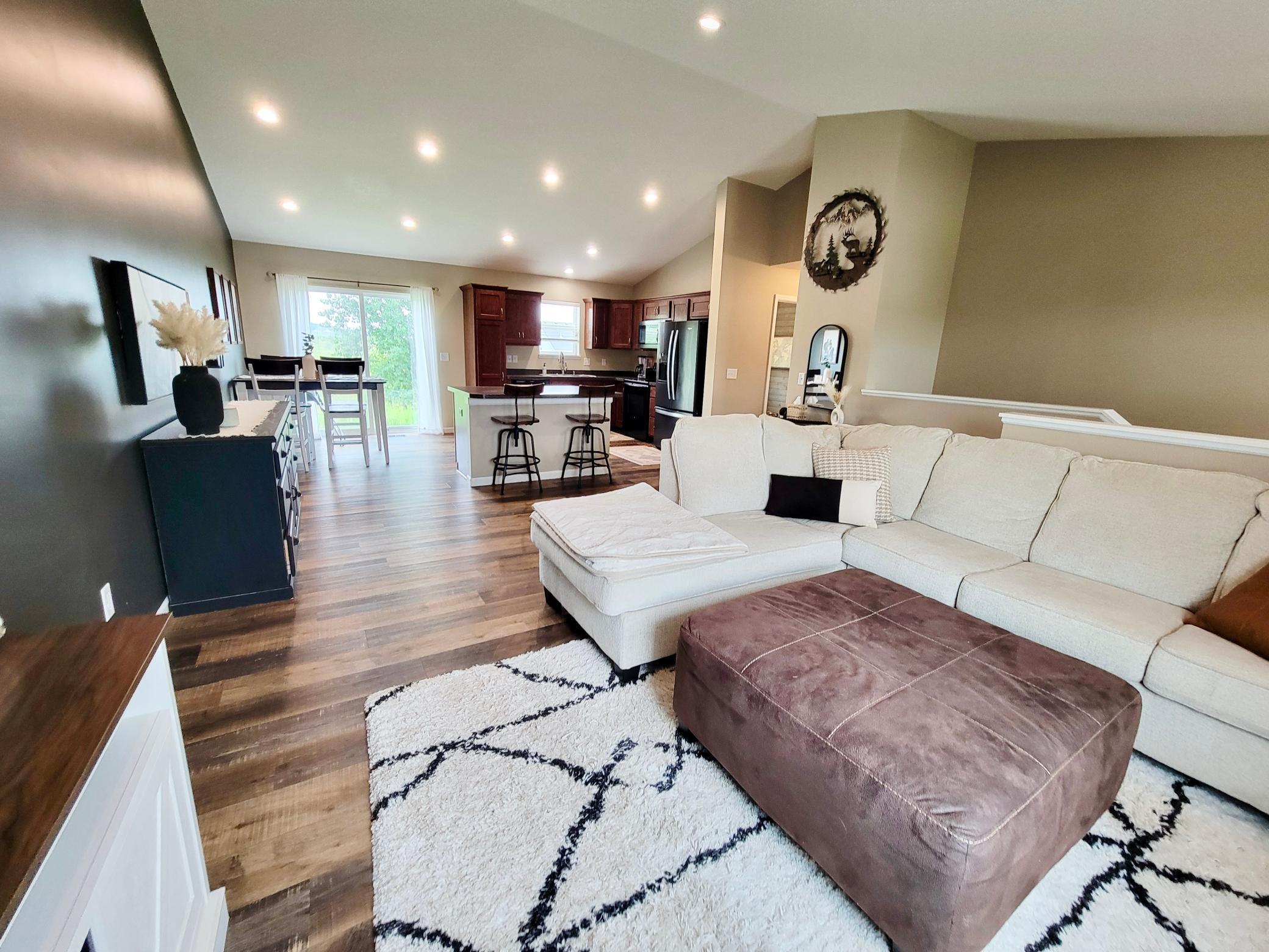 A view from the living room shows the space and options for more furniture arrangements