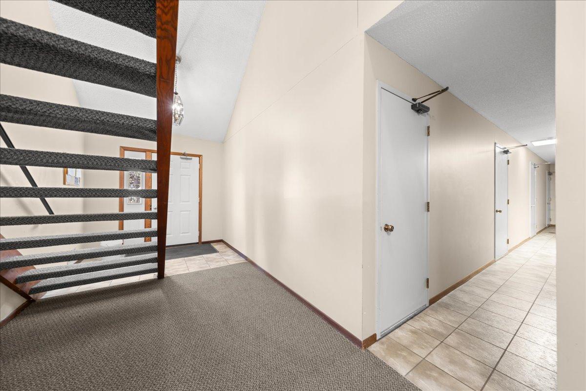 Staircase to unit and garage service door to your own private garage.