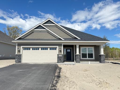 This recently completed slab-on-grade villa features three bedrooms, two bathrooms and covered back patio, backing up to a private wooded homesite!