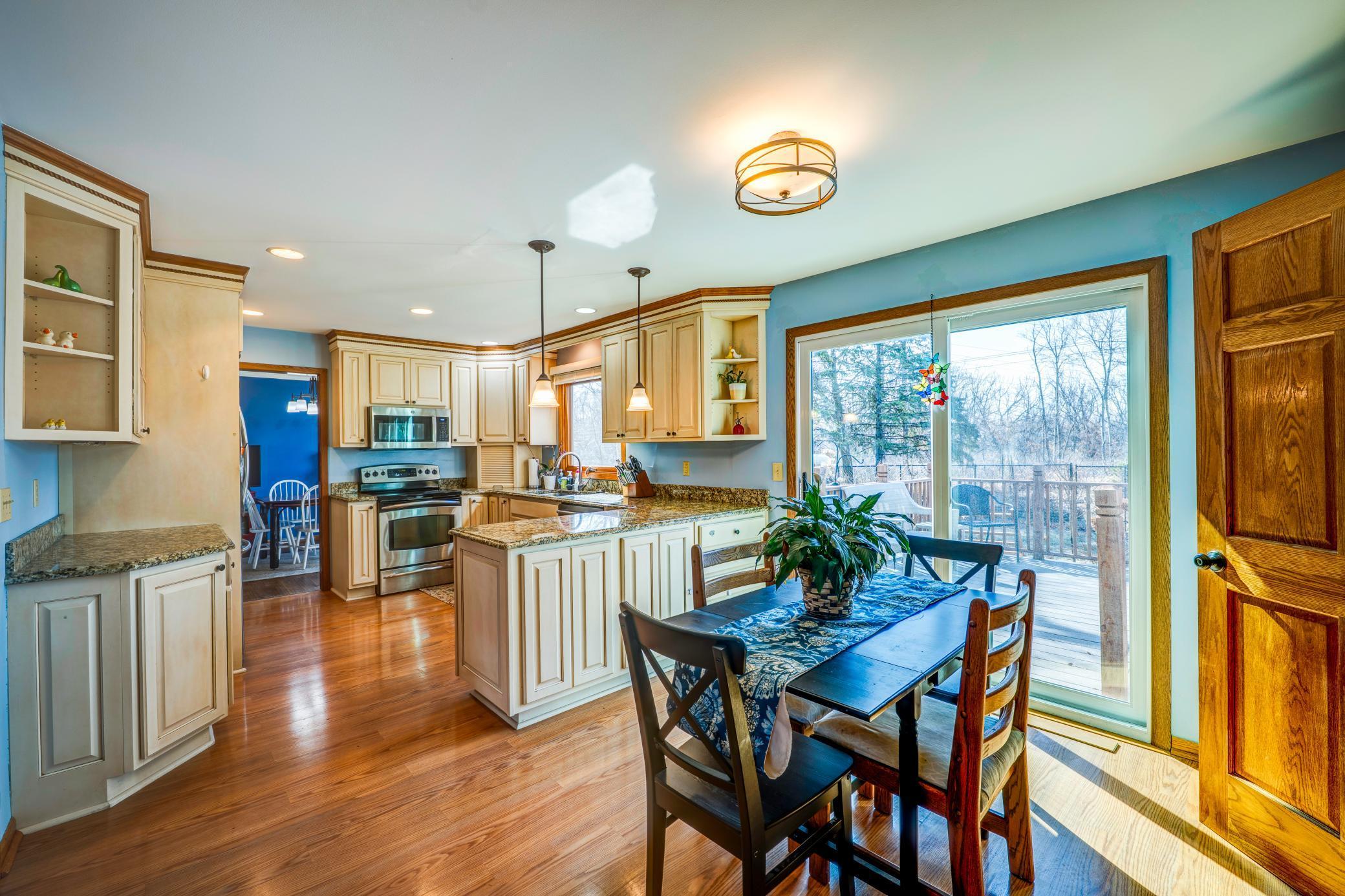 Lovely Kitchen with Patio Door to Deck