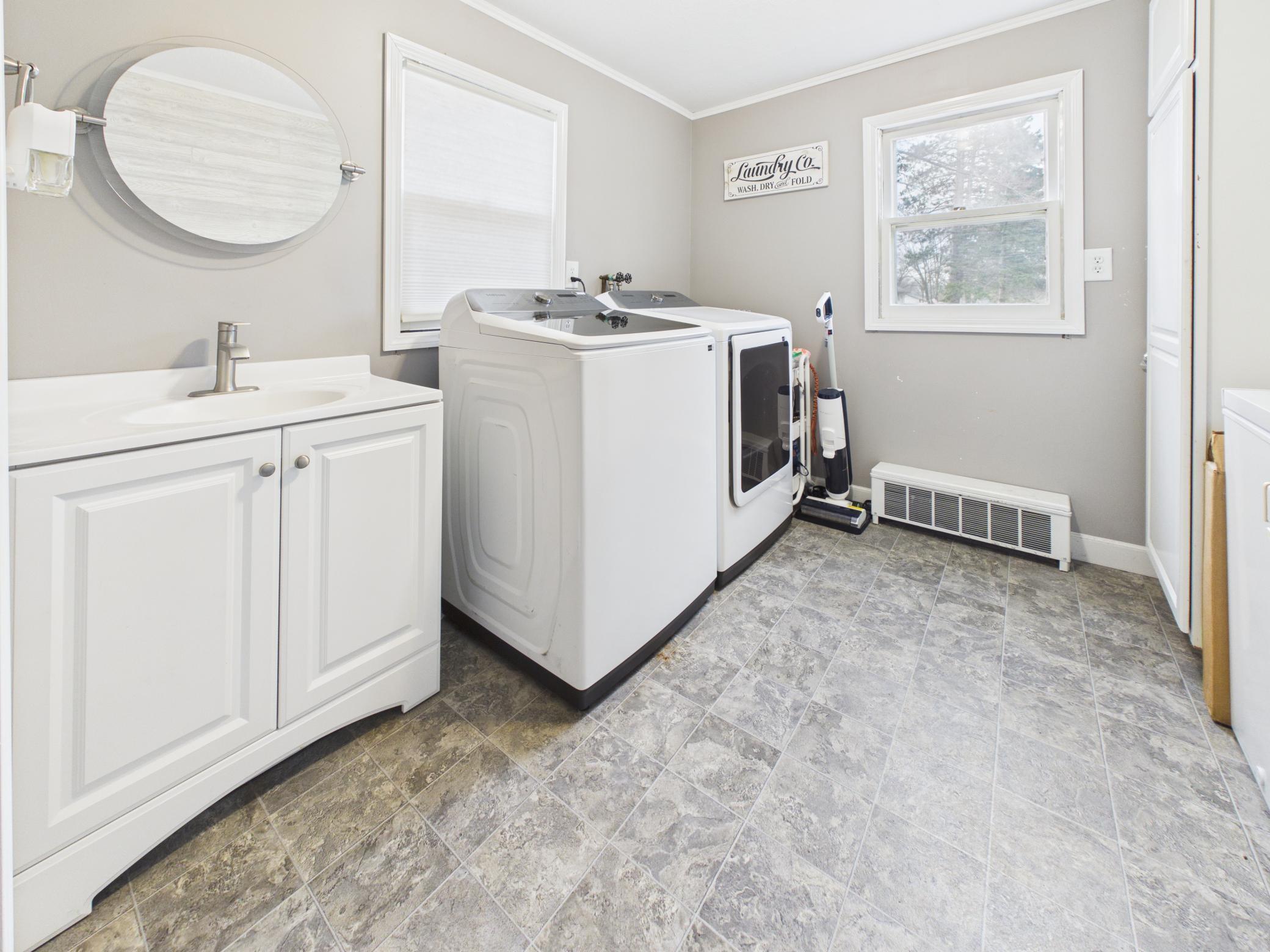 Main floor laundry with new washer + dryer.