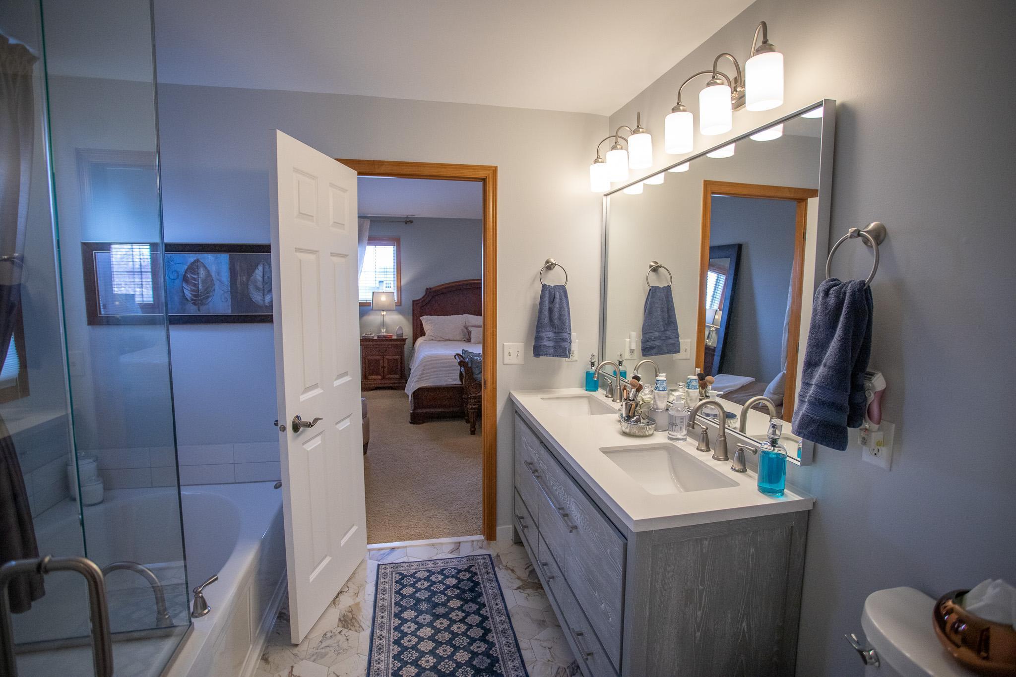 Primary bath with separate tub and shower and double vanity