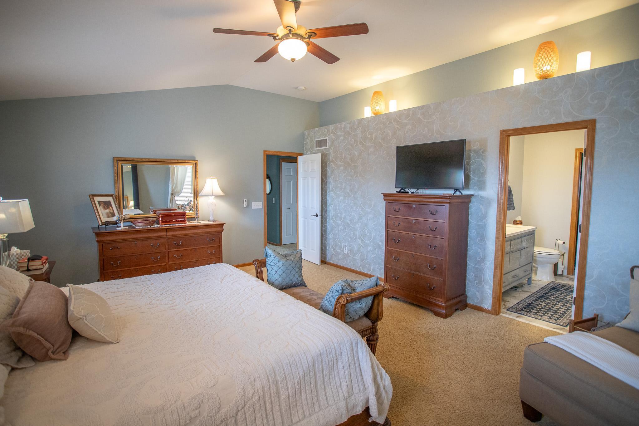 Primary suite with vaulted ceilings