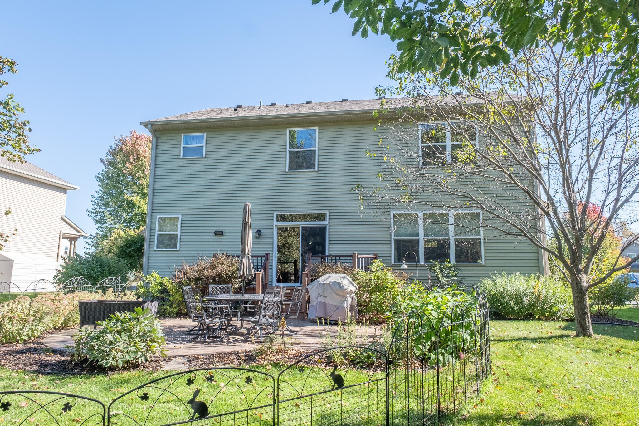 Back yard features large patio and shade