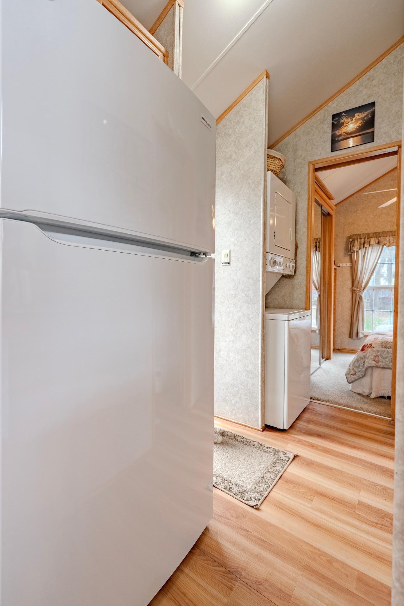 Full sized fridge and hall laundry.jpg