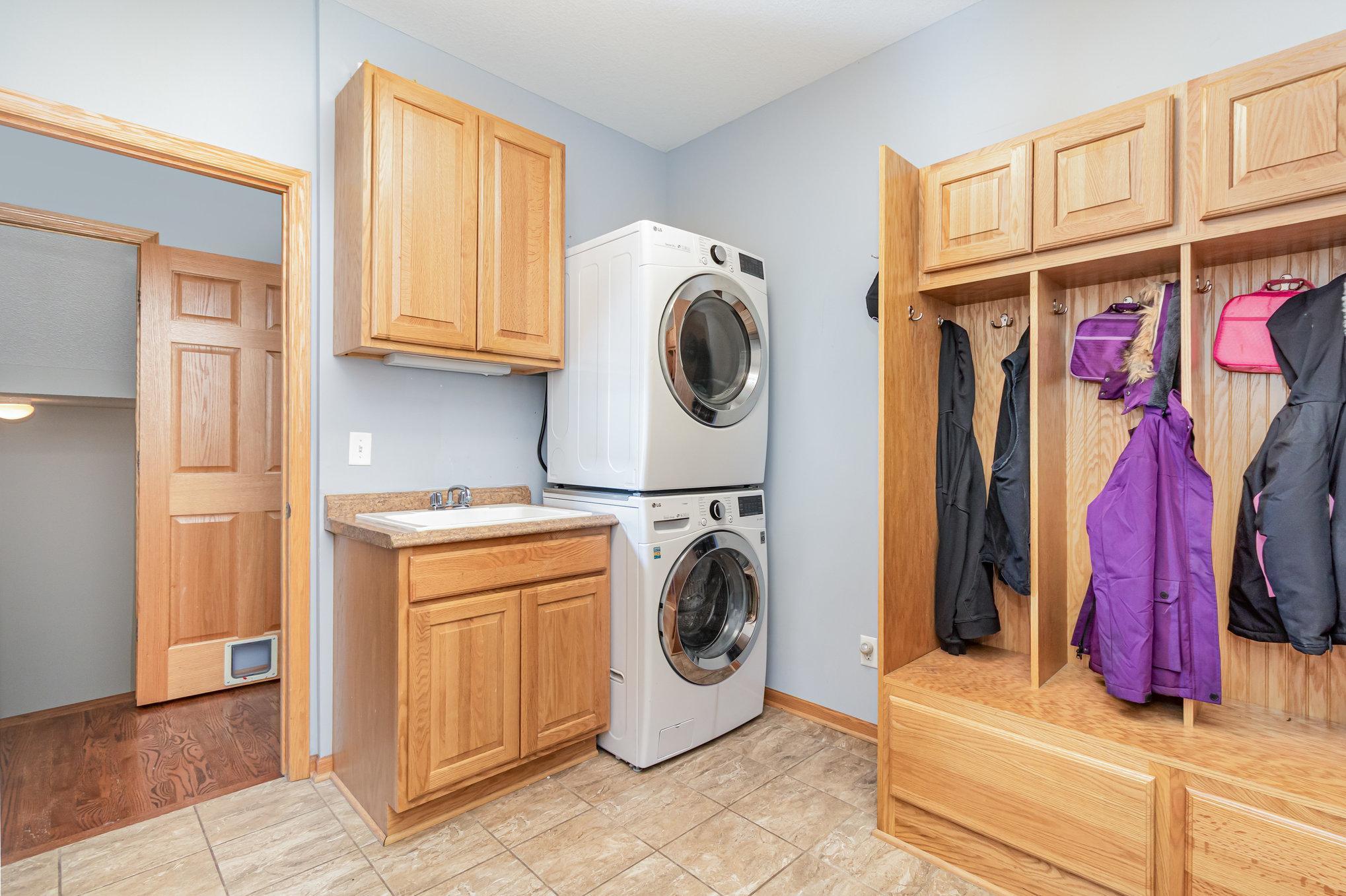 Main floor laundry with lockers