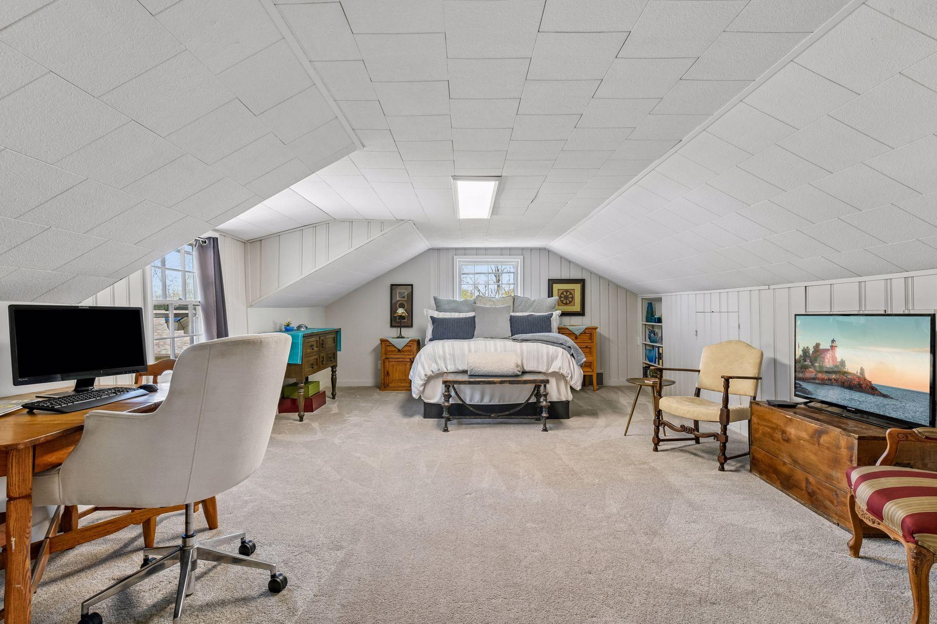 Upstairs is the spacious primary bedroom, three additional bedrooms, and a full bathroom.